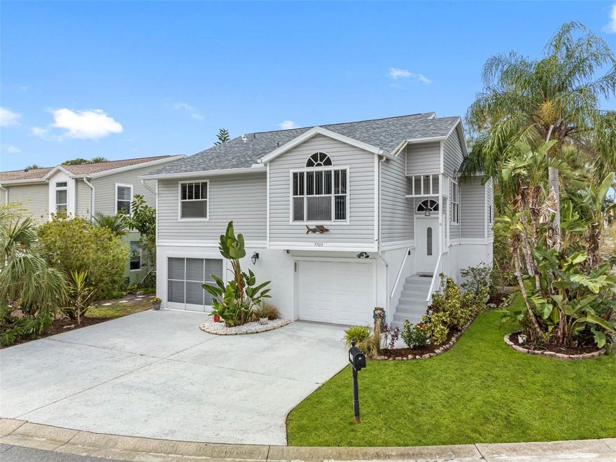 One of a kind opportunity awaits you with this highly desired Marina Palms corner lot location with serene pond and nature views. Upgraded with all the best finishes for that Coastal Florida feel so you'll be impressed with the condition of the home. The extended 2 car garage is perfect for all the toys, wave runners, and bonus space that's cooled for your comfort with a mini-split. The exquisite engineered hardwood flooring was laid diagonally throughout the home for a beautiful uniform look. Designer touches include soft grey tone colors, upgraded lighting and fans, new shades and vertices, and a eyecatching kitchen backsplash. The open kitchen is perfect to entertain with its easy access to the separate dining area and open living space. The kitchen does include stainless appliances, improved lighting, and closet pantry. Just off the kitchen is the laundry closet with a newer Samsung washer & dryer combo. The master suite is a spa retreat with vaulted ceilings, new designer vanity, dual sinks, new bath fixtures, and a new shower with pebble floor accents and stunning glass doors. The 2nd bath also has similar updates including a new vanity, fixtures, and newer lighting. The 2nd bedroom also includes new flooring, a spacious walk-in closet and yes the TV conveys. The third bedroom is the perfect flex space to make a bonus room or office area. Downstairs is simply amazing with so many possibilities. Currently it's dedicated as a bonus area, half bath space, 2 parking spaces, storage area, and entertainment area. Off the bonus space you fall in love with the open deck perfect for BBQ time or catching a small Tarpon while fishing. The home also includes a screened area on the top floor with relaxing pond and sunset views. This special place is well maintained and it's the cream puff property you've been waiting to find. See additional photos on how close you can walk along the Cotee River and stop by Sunset Marina for your day of boating.