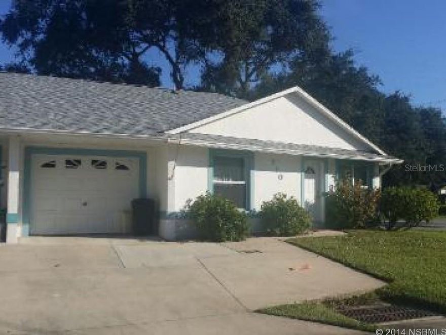 Terrific opportunity to own a rare beachside 1/2 of a duplex in New Smyrna Beach. This open floor plan with vaulted ceilings makes this a terrific getaway or permanent residence. Close to Coronado Beach Elementary School, short ride/bike/walk to shopping, restaurants, nature trails, and the beach. Store all your toys in the one car garage.ALL Measurements are approximate. ;Water: City