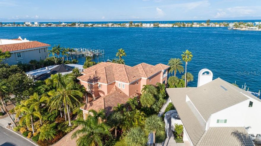 BIG WATER ! Custom John Cannon built home  directly on Pass- A-Grille Pass on Tierra Verde, immediate boat access to Gulf of Mexico, the Intracoastal Waterway and Tampa Bay and  spectacular sunsets ! This meticulously maintained home has been barely lived in and looks brand new inside and out. Featuring ,great room with fireplace, volume ceilings and full pocket sliders overlooking pool and Intracoastal  ,an oversized main floor master with direct access to pool and spa, en-suite  main floor guest bedroom, plus 2 additional bedrooms on second floor, 4 full and 2 half baths,a chefs dream kitchen next to dinning area with water view, main floor den/TV area with disappearing corner sliders overlooking outdoor fireplace and water bringing the outside in, full outdoor kitchen and outdoor dinning area. Extensive paver terraced patios surrounding the pool and spa on the  main level down to dock with two boat lifts.
The second floor has an extra large club/media room overlooking the water with a wet bar,and access to oversized outdoor deck , a bridge walkway overlooking the great room provides access to the upper  two guest bedrooms,  an office, and access to outdoor covered and open decks with a spiral staircase leading down to the main level deck and pool.
The home has a elevators shaft running from the garage floor to first and second floors as well as a 3 car tandem garage.
BE SURE TO WATCH THE WALKTHROUGH VIRTUAL TOUR!