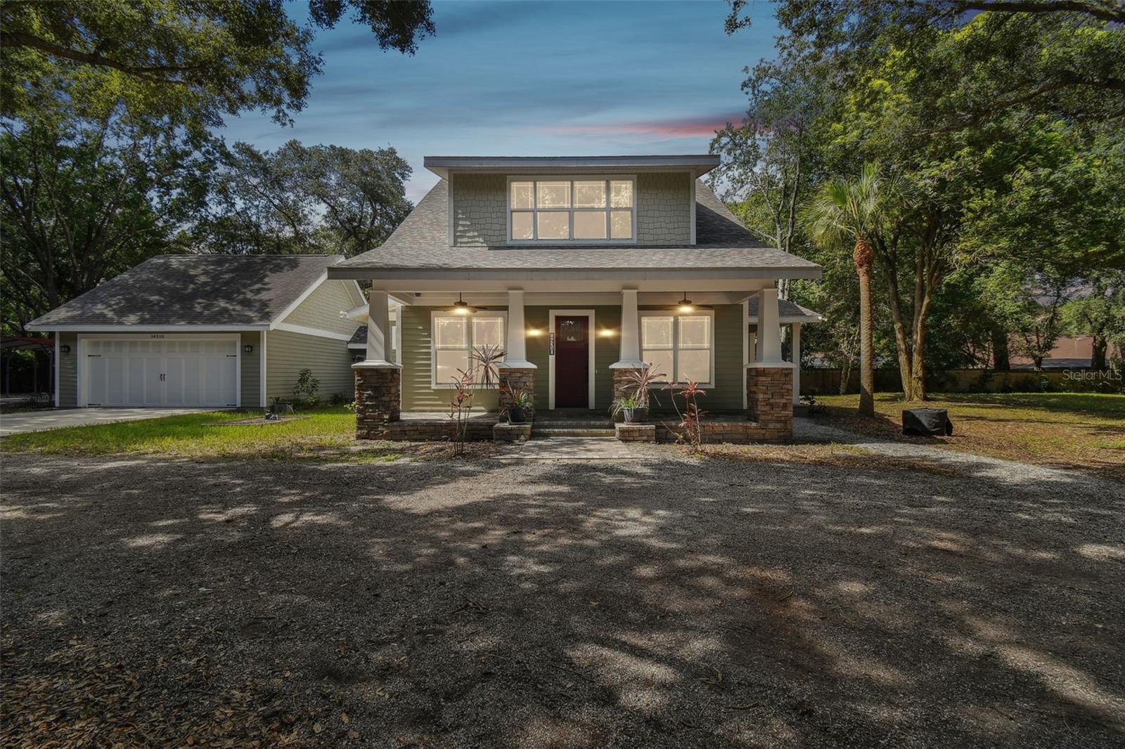 Introducing an extraordinary 3 Bed, Plus Office/playroom, 2.5 Bath, 3 Car garage, and carport property located in Carrollwood in the highly desirable Lake Magdalene. Situated on a sprawling 1.22-acre lot, this newer construction home offers the perfect combination of privacy, luxury, and functionality. Step inside this stunning property and be greeted by a spacious and inviting living space. The open floor plan seamlessly connects the living room, dining area, and kitchen, providing a perfect setting for entertaining guests or spending quality time with family. As well as a first level office. The kitchen is a chef's dream, boasting high-end appliances, abundant cabinet space, and sleek countertops. Whether you're whipping up a quick meal or preparing a feast, this kitchen has everything you need. This property features three generously-sized bedrooms, providing ample space for rest and relaxation. The master suite is a true retreat, complete with its own private ensuite bathroom and a walk-in closet. Additionally, there is one bath upstairs and one half bath in the main floor ensuring convenience for all occupants. One of the standout features of this property is the three-car garage, which includes a workshop area for those who enjoy DIY projects or have a passion for tinkering. There is also a carport, providing additional covered parking space. The outdoor space is a true oasis, with a beautiful patio overlooking the expansive lot. Imagine sipping your morning coffee or enjoying a meal while taking in the serene surroundings. There is also an outdoor propane firepit, perfect for cozy evenings with friends and family. Inside the home, a cozy fireplace adds warmth and ambiance, creating a comfortable atmosphere during colder months. Multiple storage areas throughout the property ensure that you have plenty of space to organize and store your belongings. Don't miss out on the opportunity to live in this exceptional property in Lake Magdalene. Contact us today to schedule a viewing and experience the beauty and tranquility this home has to offer.