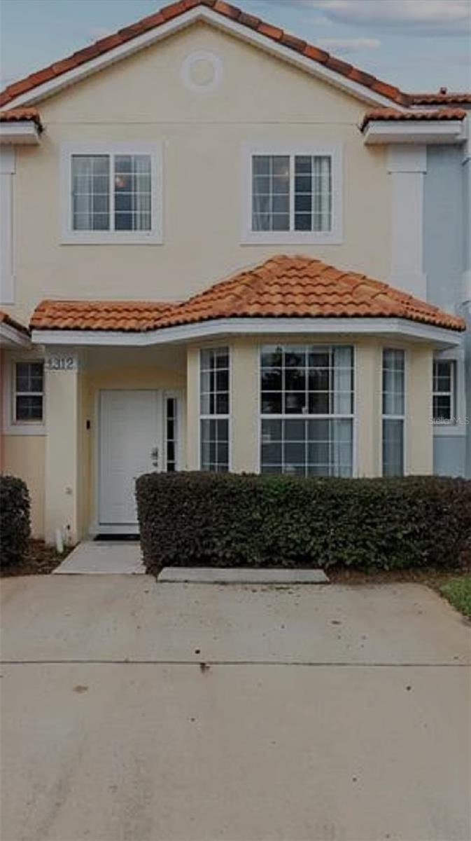 Welcome to this beautifully maintained short-term rental property, featuring a private enclosed terrace-perfect for relaxing summer nights! Nestled in the sought-after Fiesta Key Community, residents and guests enjoy resort-style amenities including a sparkling community pool, tennis courts, and a fully equipped fitness center. Conveniently located just 19 minutes to Walt Disney World® and 28 minutes to Universal Orlando®, this home also offers quick access to world-class shopping, dining, and entertainment. Whether you're looking for your primary residence, a vacation home, or an income-producing investment, this property offers flexibility for short-, mid-, or long-term rentals. Enjoy Florida living at its best while generating excellent cash flow potential!