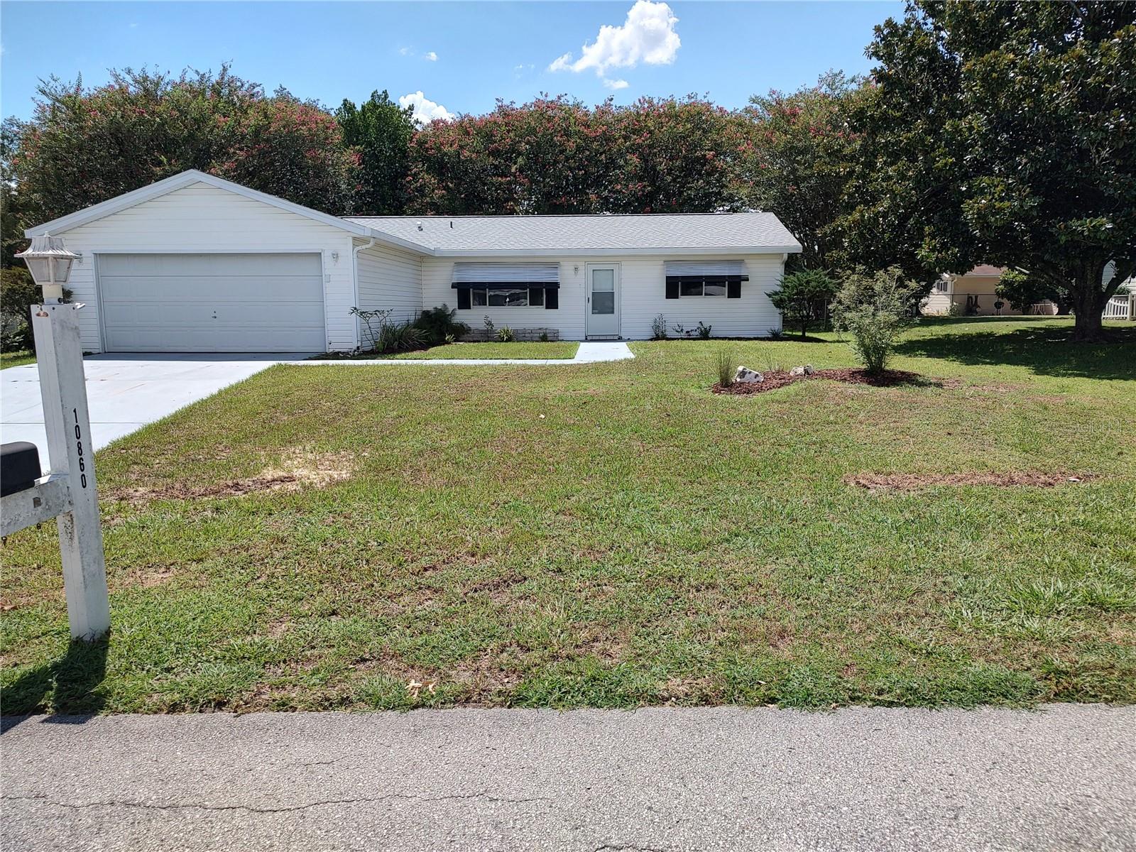 VERY COMFORTABLE 2 BDRM 2 BATH HOME ON CUL-DE-SAC IN 55+ COMMUNITY WITH AFFORDABLE HOA FEES!!! EASY CARE WITH NO CARPET IN HOME, NEW ROOF AND FENCED YARD FOR PETS OR THE GRANDKIDS!! LARGE LIVING ROOM IDEAL FOR ENTERTAINING AND DINING AREA OVERLOOKS 12 X 15 SCREEN ENCLOSED PORCH AND YARD. KITCHEN WITH ALL APPLIANCES STAYING, SOFT CLOSE CABINETS AND DRAWERS PLUS ROOM FOR A BAKERS RACK OR BISTRO TABLE AND CHAIRS. 2ND BDRM IS A SPACIOUS 12 X 15 WITH WALK IN CLOSET, CEILING FAN AND NEXT TO BATHROOM WITH SHOWER TUB COMBO AND LINEN CLOSET FOR EXTRA STORAGE. INSIDE LAUNDRY INCLUDES OPEN FACED STORAGE CABINETS AND LEADS TO THE 2 CAR GARAGE. PRIMARY BDRM IS 14 X 15 WITH ROOM FOR ALL YOUR FURNISHINGS PLUS WALK IN CLOSET, CEILING FAN AND CUSTOM TILED SHOWER IN THE ENSUITE BATHROOM. PLEASANT LANDSCAPING THAT IS EASY CARE SO YOU CAN ENJOY MORE AND WORK LESS. SHADE TREE IN THE BACKYARD AND BEAUTIFUL MAGNOLIA IN THE FRONT. COMMUNITY OFFERS POOL, CLUBHOUSE WITH COMMUNITY EVENTS, FITNESS ROOM, SHUFFLEBOARD AND A FIRST COME FIRST SERVE RV OR BOAT LOT. CONVENIENT TO EVERYTHING ON THE HWY 200 CORRIDOR BUT SITUATED IN A QUIET LOCATION. YOU NEED TO SEE THIS AFFORDABLE HOME!!