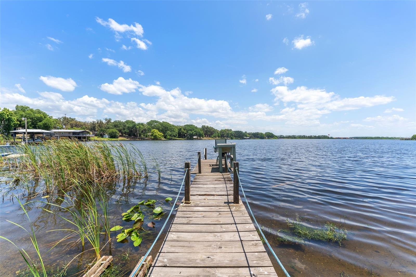 Presenting a buildable lot for sale on beautiful Lake Agnes! Offering a lifetime of beautiful sunrises from your future back porch. This ideal future lake house getaway is perfect for the fishing and boating enthusiasts. Nothing but opportunity here!! This spacious 70ft by 230ft (.39 acre) lot can be sold individually or in conjunction with the adjacent lot for a total of .77 Acres. The adjacent lot is MLS#TB8403006 . There is a single wide on the property that will convey with the sale. The property currently has city water and electric in place. No survey is available from the seller at this time. X and AE flood zones. Conveniently located near Fantasy of Flight and easy access to I-4 Tampa or Orlando, this future home site offers a balanced blending of tranquility yet accessibility to local attractions.
