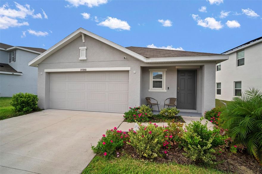 Under contract-accepting backup offers. Skip the waitlists and construction dust—this beautifully maintained Alex II model was built in 2023 and is truly move-in ready. Featuring 3 bedrooms, 2 bathrooms, and an open-concept layout, this home offers stylish finishes and modern functionality without the uncertainty and delays of new construction.

Perfectly situated in one of the best locations within Harvest Ridge, this property is just around the corner from the community pool and cabana—ideal for relaxing weekends in the Florida sunshine.

Harvest Ridge is a boutique neighborhood with fewer than 300 homesites, creating a welcoming and intimate feel. Nestled in the heart of Zephyrhills, the community offers easy access to SR-54, downtown Zephyrhills, and a variety of charming local spots including antique shops, bakeries, Tina and Joe’s Café, and Zephyrhills Brewing Company. For larger shopping and dining options, Wesley Chapel’s Wiregrass Mall and Tampa Premium Outlets are only minutes away, and downtown Tampa is just a 40-minute drive.

With no long construction timelines, no waiting for amenities to be finished, and a prime location in the community, this home is the perfect blend of new and now.
