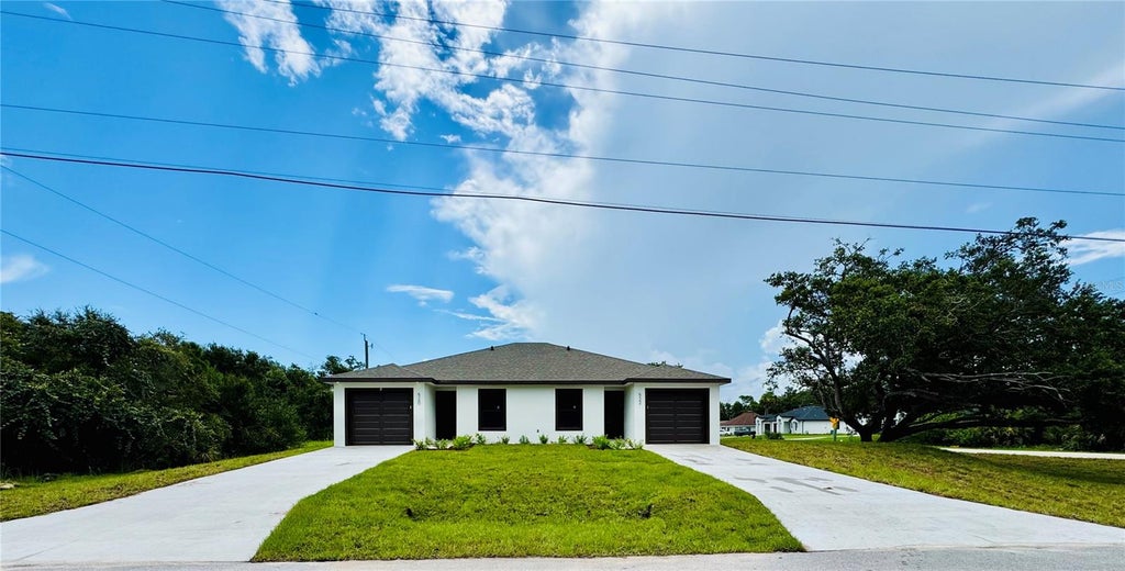 Photo of 15506 Chamberlain Boulevard, Port Charlotte, FL 33953 (MLS # O6402252)