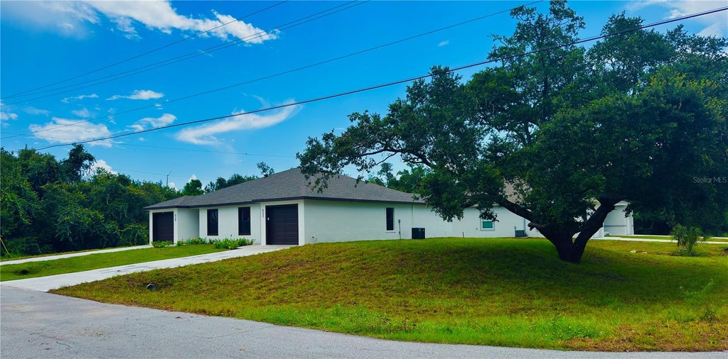 Photo of 15506 Chamberlain Boulevard, Port Charlotte, FL 33953 (MLS # O6402252)