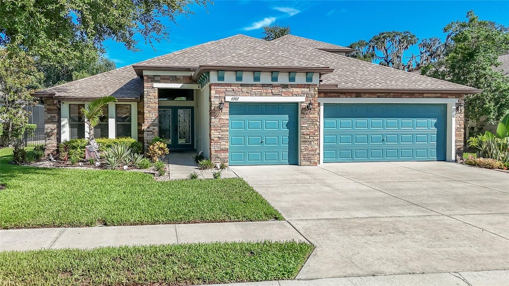 Photo of 4907 Pointe O Woods Drive, Wesley Chapel, FL 33543 (MLS # TB8526776)