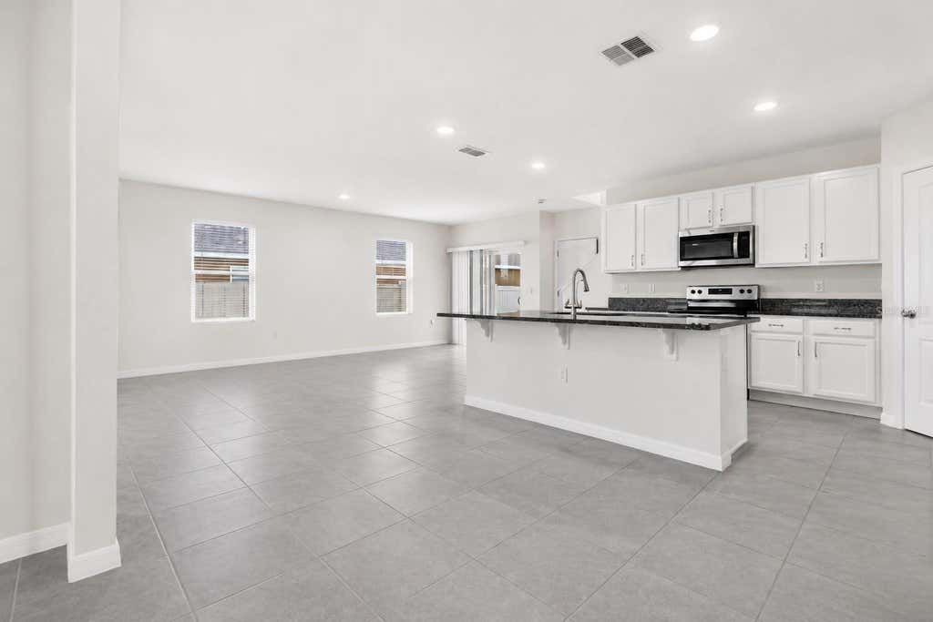 Photo of 1021 Silverbell Trail, Saint Cloud, FL 34771 (MLS # O6434414)