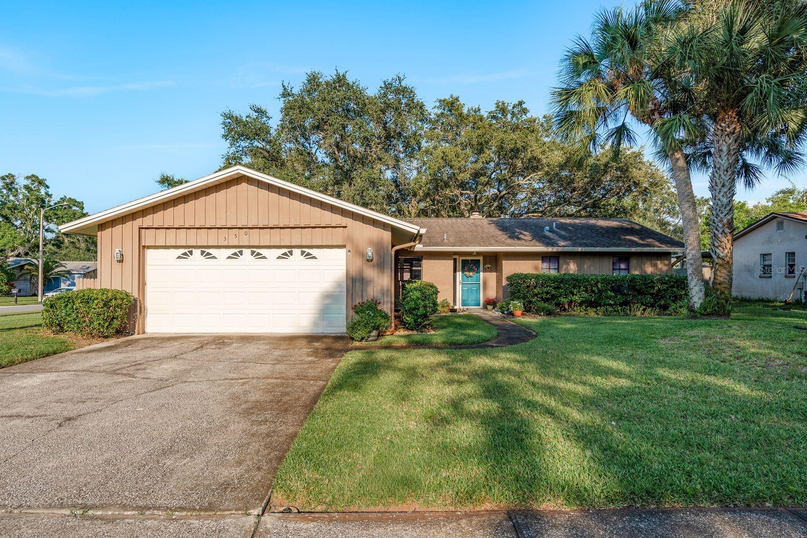 Under contract-accepting backup offers. Welcome to your new home in the desirable community of Patty Ann Acres , Palm Harbor ! This beautiful 3-bedroom,2-bath single-family home sits on a spacious corner lot and offers both comfort and convenience. The property features a two-car garage and a large backyard,perfect for gatherings or simply enjoying Florida's sunshine. Inside, you will find and inviting living room with a stunning fireplace,ideal for cozy evenings.The home's layout provides a great flow for entertaining while still offering private retreats in each bedroom. This lovely home offers a brand new HVAC,Water heater 2020 and a water softener system! Located in one of Palm Harbor's most sought-after neighborhoods,this home is surrounded by top rated schools,making it an excellent choice for families.With the ideal location,generous outdoor space and timeless charm, this home is ready to welcome it's next owner.Tour today,Buy tonight!