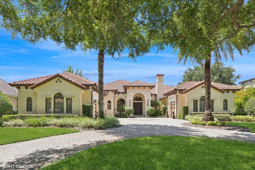 Discover this stunningly beautiful Masterpiece! This Exquisite custom-built estate home is located behind the 24-hour guarded gate in the prestigious community of Reserve at Lake Butler Sound. Situated on over half-acre, this luxuriously appointed home, offers generous living spaces, elegant archways, and artfully designed ceilings throughout. This home welcomes you with a circular paved driveway and courtyard access to the column enhanced front entrance, with 3 oversized garages. The master craftmanship is evident in the refined finishes which include wooden intricate inlaid patterns in tray, coffered or wooden beamed ceilings, stately Corinthian columns, travertine floors with deco tile insets, cherry wood floors, exquisite chandeliers, stoned archways, custom millwork and transom windows that capture lots of natural light. Upon entering the detailed custom front doors into the foyer, you will notice the breathtaking views straight ahead through the Grand living room to the tropical paradise, an open pool and spa, and the lush green, tree-filled conservation Preserve. The formal dining room, great for those elegant dinner parties, is to the left of the foyer and is conveniently situated close to the living room with a finely crafted ceiling and a built-in Curio Cabinet. Found in the heart of the house is the delightful kitchen and a separate breakfast area, as well as an expansive family room with a built-in stone entertainment center. Enjoy the state-of-the-art family room and entertainment gathering space with built-in sound system. Adjoining is the game room, with a full wet beverage bar, refrigerator, ice maker and its own built-in entertainment center. These areas are all located next to the large sliding patio doors which open out to the lanai and the expansive oasis-styled pool and spa with its soothing fountains. This stately and luxurious Sanctuary offers a summer kitchen and dual sided fireplace. The kitchen features beautiful State of the Art stainless steel appliances, customed detailed traditional cabinetry, dramatic black granite counters, a six-burner gas range with stone range hood, a breakfast bar, a center island with a prep sink, built-in oven, microwave, a warming drawer, a full-sized built-in refrigerator, a beverage cooler and a very spacious secret pantry. There is a large guest bedroom with a walk-in closet and ensuite bath that is also accessible from the hallway at the rear of the home for ultimate privacy for guests. Two additional extra-large bedrooms with walk in closets and private ensuite baths and the laundry room complements this side of the home. The right wing of the home includes the guest bath, the large home office with a built-in cabinet/shelving unit, double doors to the breezeway at the front of the home and the Master Suite. The master bedroom is an elegant generous space with a French doors access to the lanai. The ensuite bathroom provides a spa like experience with its shower enclosure with wall massage jets, handheld and rainwater shower heads, a large, jetted tub, private room with toilet and bidet, and a double sink vanity with spacious linen cabinets at either end. The enormous master closet is efficiently laid out with built-ins. There are numerous entrances from different areas of the home to the L shaped lanai. This space is wrapped around the pool and spa and is a relaxing place to enjoy beautiful Florida sunset views over the conservation area.