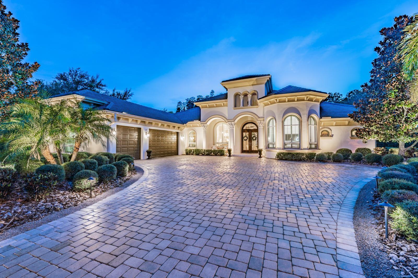 Tucked away in a serene enclave of 45 Homes, this Award Winning Marc Rutenburg “Castaway” Model Home is nestled on a Lushly Landscaped, Cul-De-Sac lot, with Pond Views, and a Private Preserve setting. This Designer Home has been Meticulously Updated, and is a true showcase of Elegance and Luxury, with over $500K of Upgrades! High-End Designer Finishes, Gorgeous Architectural Details, & Flowing Floor plan make it a true Entertainer's Dream! Oversized Pavered driveway welcomes you to this sprawling 4,687 Sqft 4 Bed (plus Office + Bonus Room), 3 Bath, 3 Car Garage, DREAM HOME with a NEW Resort Style Pool area. Beautiful Leaded Glass, Brazilian Wood Double Doors open to the Formal Foyer and Formal Living + Dining area - an Entertainer's Dream! Soaring Ceilings w/ Deep Crown Molding, and Gorgeous Marble Floors set the tone as you walk in. The Chef's Kitchen is STUNNING and Features Custom Cabinetry, Upgraded Quartz Countertops (2021) with Full-Height Backsplash, Viking Professional Series Appliances, Double Ovens, Custom Vent Hood, 48 Inch Natural Gas Stovetop with Grill/Griddle, Pot Filler, Wine Fridge, & Large Walk-In Pantry. Breakfast Nook overlooking the natural preserve. Family Room with Custom Built-In Entertainment Center finishes the feel of the room with Elegant "Cast Stone" Wood Burning Fireplace and sculpted European designed Francois Mantle. Beautiful Engineered Wood Flooring throughout Main Living Space with two sets of French doors providing an abundance of natural light and access the Patio Area. The Owner’s Suite features 12 foot coffered ceilings with Anderson Hardwood Floors, Custom Electric “Water Vapor” Fireplace with beautiful Mill Work, and sitting area with Bay Window. Spa-Like Master Bath with Italian Gold Marble Floors and Countertops, Double Sink Vanity, Jacuzzi Tub, Walk-in Circular shower with Dual Shower Heads, Back Wall Shower Heads, Rain Shower, and Bench Seating. Dual walk-in closets with organizers. The formal Study is just off the Master Suite with Rich with Flooring and Plantation Shutters. Two additional bedrooms split away from the Master, one with High End Custom Bed/Built-In Setup. Guest Bath w/ Dual Sinks, Quartz Countertops, and Tub Shower Combo. 4th Bedroom is larger than most master suites (second Master) with Window Seating, Built-ins, Private En-Suite Bath with Large Vanity, Step-in Shower, Jetted Tub and Large Walk-in Closet with Organizers. Bonus Room/Media Room with Custom Built-In Wall, Plantation Shutters, and Built-In Speaker System. The Resort Style Pool Area was Completely Remodeled in 2021 creating a Modern and Luxurious outdoor living experience. Tasteful Outdoor Kitchen with Concrete Counters, Stacked Stone Wall, Built-In Grill, Sink, Fridge, Tile Backsplash, and European Stone Finish. Large Covered Area with Cypress Wood Ceiling and Custom Cast Stone Outdoor Fireplace area creates the Perfect Place to relax with a Coffee in the morning or a Glass of Wine after a long day. Two-Tier Travertine Pool Deck with Newly Remodeled Saltwater Pool has Custom Caribbean Glass Tile, Self Cleaners, Sun-Shelf with Ledge Lounger In-Pool Chairs, Fire Bowls, and Custom Lighting. Laundry room with Front Load washer & dryer, Cabinets for Storage, Countertop Space & Farm House Sink. The Preserve at Hawks Landing is a gated community located in the highly sought after East Lake High School district. Convenient to shopping, beaches, golf, & airport. See Feature Sheet for More. All Furnishings Negotiable.