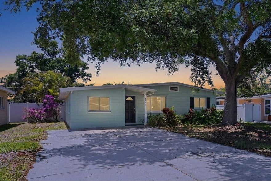 This lovely Saint Petersburg home is centrally located with easy access to 2 wonderful parks and all the great eating, shopping and entertainment amenities along HWY 19. The exterior of this property is perfectly appointed to maximise the beautiful Florida sunshine. Enjoy a fenced yard, covered outdoor gathering space, enormous patio area and inviting pool with lanai.  With all this space, your dreams of the perfect outdoor living area can become reality.  The updated interior features LVP flooring throughout with white trim and subtle,neutral paint.  The charming kitchen has white cabinets, upgraded counters and stainless appliances.  Ample cabinet and counter space make it both stylish and functional.  The open floor plan and great natural light give the home a welcoming personality perfect for entertaining friends and family.  There are 3 bedrooms including an owners suite with a 3/4 bath with walk-in shower.  You'll love the access to the pool and patio area through your private bath.  An updated full bath is convenient for both guests and residents and you are going to love having your utility/laundry room tucked away off the kitchen.  This is the property you've been waiting for, Welcome Home! This home has been virtually staged for your enjoyment!
