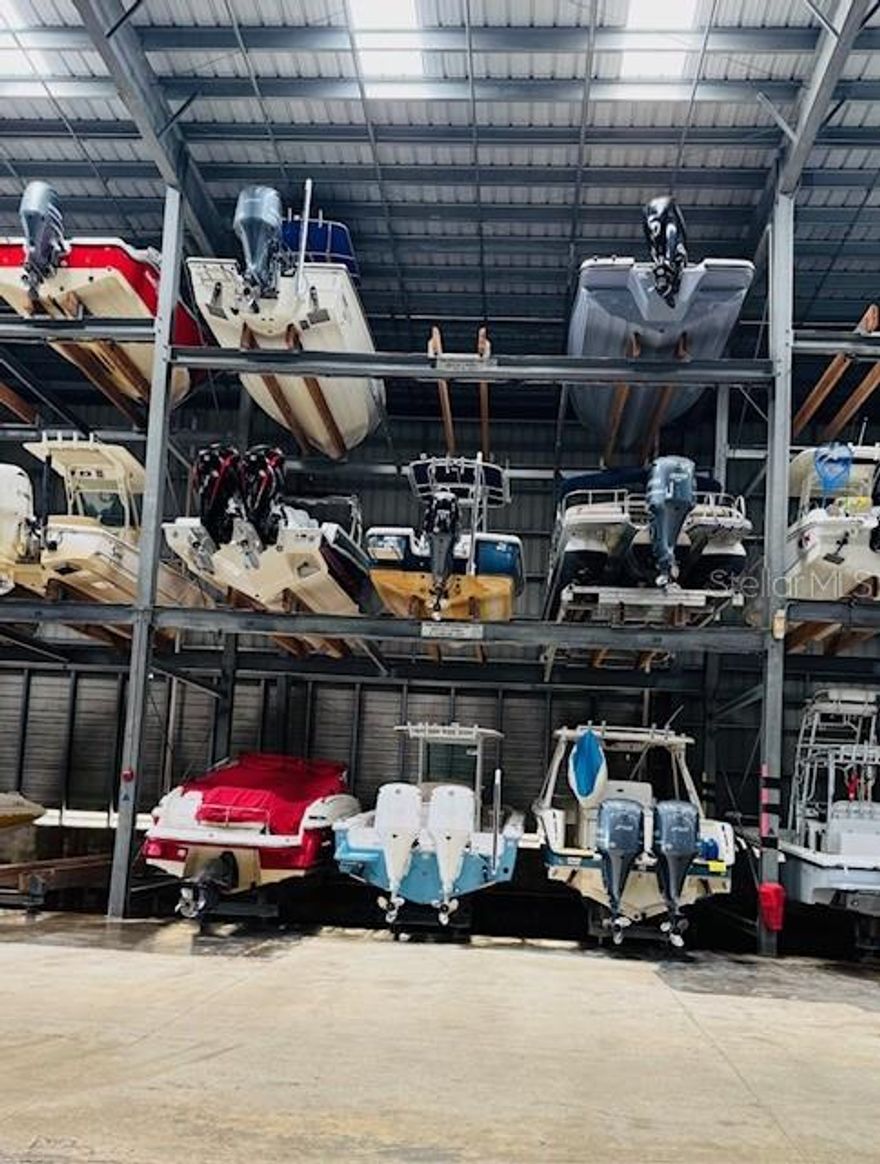 At Phillippi Harbor Club, your boat is stored inside a hurricane-rated building designed for maximum protection and security, giving you confidence and peace of mind year-round. The monthly fees are competitively priced, allowing you to enjoy premium amenities without overspending. Membership includes convenient valet launch service, discounted fuel, wash-down stations, shower facilities, service racks, professional detailing options, and your own private assigned locker. The rack measures 32'Lx10'Wx9.5'H. The facility is situated on sheltered waters along beautiful Philippi Creek, the club offers direct access with no bridges between you and the Intracoastal Waterway, making departures quick and effortless. You can reach the Intracoastal in roughly four minutes and the Gulf of Mexico in about twenty minutes. More than just boat storage, Phillippi Harbor Club provides a welcoming environment for boaters who appreciate convenience, protection, and community.