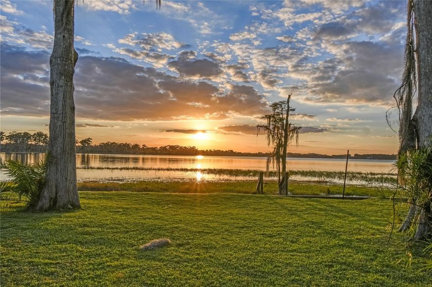 Experience the rare opportunity to own over 4.5 acres on the prestigious Butler Chain of Lakes, nestled along the exclusive “Millionaire’s Row.” This expansive 4.56-acre estate features approximately 2 acres of buildable land and 100 feet of pristine Lake Sheen frontage—perfect for boating, skiing, and all water sports. A 4-bedroom, 2-bath residence currently occupies the property. The home is livable but largely original to its 1973 build date, offering immediate usability while leaving most of the value in the land itself. Surrounded by mature landscaping and accessed by a long private drive, the property offers exceptional privacy. Enjoy breathtaking sunsets and nightly Disney fireworks right from your backyard. With no HOA, A-rated public and private schools nearby, and close proximity to Restaurant Row, Disney, Universal, and the new Epic Universe, as well as convenient access to I-4 and Orlando International Airport, this is truly a once-in-a-lifetime opportunity to build your dream estate in one of Central Florida’s most sought-after lakefront locations.