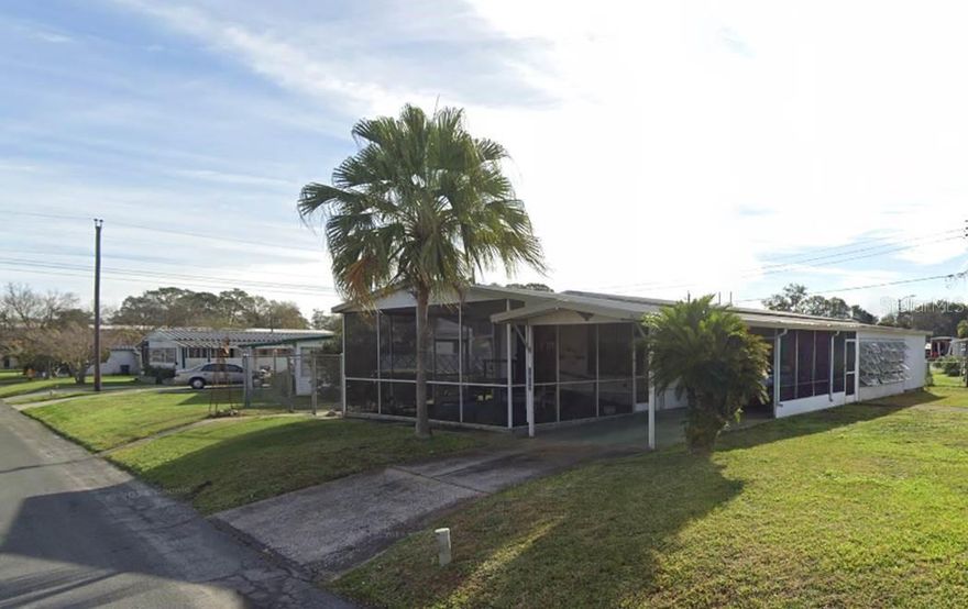 Renovated and ready for new owners!  This charming 1978 manufactured double-wide home in a desirable 55+ community offers an open floor plan, modern updates, and the expansive screened Florida Room extending the living space making it ideal for relaxing and entertaining.  Handicap accessibility throughout this property, low HOA Dues $240 a YEAR, there is NO LOT RENT because YOU OWN THE LAND!  The yard is partially fenced for your pets; 2 maximum with no breed restrictions and no weight restrictions.  Exterior offers long drive way with carport that can cover two cars, two covered porches in addition to the Florida Room and a laundry room/workshop.  Priced to sell - don't miss this opportunity to own an affordable Florida retreat!