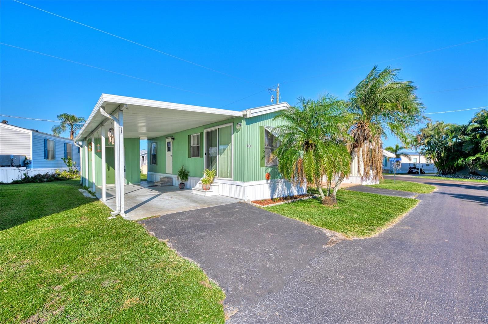 MOTIVATED SELLER! ALL OFFERS WILL BE CONSIDERED! Welcome to this charming & furnished 1 bedroom, 1 bath mobile home nestled in the peaceful and beautiful 55+ waterfront community of Lazy Lagoon! This lovely home offers the perfect blend of comfort and convenience, with modern updates, including a newer roof (2022) and a brand-new A/C unit (2024), ensuring year-round comfort in any season. Step outside to your own covered one-car carport, providing a secure place for your vehicle and an additional storage shed for all your extra items. Inside, you'll be greeted by a bright and airy living space with a great room featuring sliding doors and large windows that let in plenty of natural light. The cozy kitchen comes equipped with a stove, microwave, and a newer refrigerator, along with abundant cabinet space for all your cooking essentials. Lazy Lagoon isn't just a place to call home; it's a vibrant, active community offering an array of fantastic amenities. Enjoy the private road and extra guest parking, plus the exclusive boat ramp where you can launch your boat or kayak to explore the scenic Shell Creek. For the avid fisherman, there’s a convenient fish cleaning station to make your catches even more enjoyable. The 2,000 sq. ft. clubhouse, complete with a commercial kitchen, is perfect for hosting community events or private gatherings. If you're in the mood for some friendly competition, the shuffleboard courts and billiards/pool room are just a short walk away. For boating enthusiasts, Lazy Lagoon boasts over 2,000 feet of beautifully maintained shoreline and a private, secured compound where you can store your boat or trailer for a small yearly fee. The community is also just minutes from downtown Punta Gorda, offering even more dining, shopping, and entertainment options. Don’t miss out on this incredible opportunity to live in a peaceful, well-equipped community. Call today to schedule your private tour and discover all the wonderful features this home has to offer!