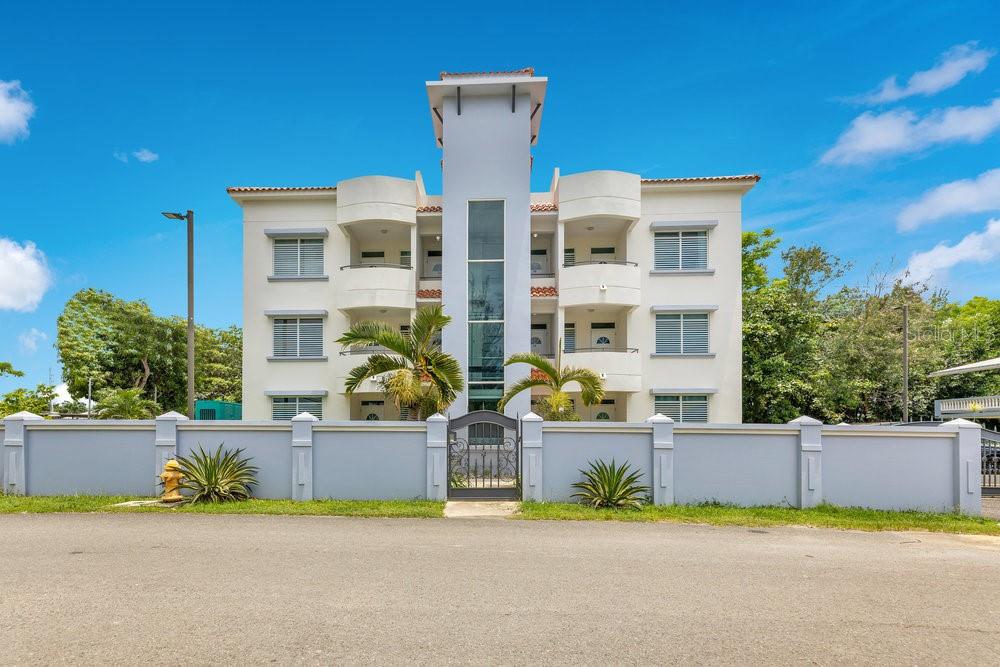 Welcome to Sea Beach Colony Apartments, where convenience meets coastal charm. This gated penthouse apartment places you just steps from sandy shores, local dining, and the best of Rincón living. With the elevator bringing you right to your door, you’ll enjoy high ceilings in the open living and dining areas, natural light throughout, and a layout that feels spacious and inviting. Turn key ready!
The residence offers 2 bedrooms, 2 bathrooms, a primary suite with walk-in closet, and a laundry closet with washer/dryer combo all on the same level. It comes fully furnished and equipped, with mini-split A/C units throughout for comfort. Two assigned parking spaces, a backup generator, and a water tank ensure peace of mind. Utilities not included. Available to lease now.
A highlight of this property is its rooftop terrace, the perfect spot for watching sunsets, entertaining friends, or simply soaking in ocean views. Located close to RD-115, you’ll have quick access to adjacent towns while still enjoying the walkable lifestyle of restaurants, shops, and beach access just outside your door.
Experience the ease of a lock-and-go beach penthouse with all the essentials for comfort and style included. Call today to schedule a viewing!