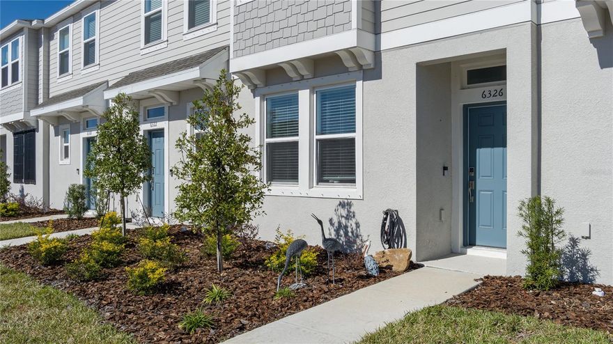Welcome to the Camellia I floor plan in Edgestone at Artisan Lakes, a beautifully planned community in North Manatee. This townhome offers a smart, comfortable layout that fits a variety of lifestyles. At the front of the home, a flexible room can be used as a dining area, office, play space, or whatever your routine calls for. The kitchen provides plenty of countertop space and flows directly into the main living area, creating an open feel that’s great for everyday living or hosting friends. A half bath is conveniently located on the first level.
Upstairs, the owner’s suite is designed for privacy with its own spacious walk-in closet and a well-appointed bathroom that feels more like what you’d find in a single-family home. The secondary bedroom sits down the hall with its own walk-in closet and easy access to a full bathroom. The laundry area is also located upstairs for added convenience.
Out back, enjoy peaceful pond views and the benefit of being just a short stroll from the community pool. Edgestone at Artisan Lakes is ideally positioned near I-75, I-275, and US-41, making travel to Anna Maria Island, Downtown Tampa, and surrounding areas simple. Everyday necessities like Publix, restaurants, schools, and the Ellenton Premium Outlets are all just minutes away.
This townhome blends comfort, convenience, and location in one great package. Come see why this community continues to be one of the most desirable spots in the area.