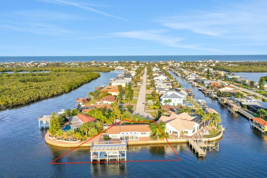 181 FT DIRECT INTRACOASTAL FRONTAGE IN PONCE INLET!  Introducing the Crown Jewel of Ponce Inlet, Florida – The Most Desirable Direct Riverfront Property on the East Coast! This beautiful barrier island gem offers the epitome of luxury living with unparalleled privacy and a host of incredible features.
Private Waterfront Oasis: Step into a world of exclusivity with a private waterfront backyard with a soaring two-story boat dock with a 10,000lb lift, gated for complete privacy. Your very own sanctuary awaits!
Deep Water Intercoastal Access: Boating enthusiasts rejoice! Enjoy 181ft of direct deep water Intracoastal access, a mere 15-minute cruise to the open waters of the Atlantic Ocean, and all without the hindrance of bridges. Park your 100ft plus yacht on your privately owned submerged Intracoastal Riverfront property, complete with ample space for jet skis, boats, and water toys.
Private Deep Water Marina: Immerse yourself in luxury with your private deep water marina on the submerged Intracoastal property. This is not just a home; it's a waterfront lifestyle!
Cul de Sac Dream: Nestled in a private cul de sac lot, this property is a dead-end circle, creating a haven of tranquility. Your very own private compound awaits, providing the perfect retreat.
Proximity to Emerald Isle Beach: Just a 5-minute walk away lies the pristine Emerald Isle beach, offering convenient ocean access. Enjoy the best of both worlds – riverfront luxury and beachside bliss.
Spectacular Views: The Intracoastal Waterway with privately owned submerged land presents an incredible canvas for development. Imagine a 3-story new construction potential with a rooftop veranda, offering unobstructed 360-degree views of sunrise to the East and sunsets to the West. No condos to obstruct your breathtaking vista!
Prime Location: Located an hour east of Orlando and an hour south of Jacksonville, this dead-end 5-mile barrier island is a true gem. The journey ends at the iconic Ponce Inlet Lighthouse, the tallest lighthouse in the state of Florida.
Convenient Access: An international airport is just 15 minutes away, ensuring that your waterfront paradise is easily accessible for those seeking the epitome of luxury living.
Development Potential: This property is not just a home; it's a canvas for your dreams. With a parcel ready for development, envision a 7500-plus sq ft home with the potential for a rooftop veranda, creating a haven of luxury and comfort.
Current Home Highlights: The existing home occupies just half the lot, featuring a new roof, electrical panel, and impact windows throughout. Revel in the abundance of natural light and, of course, the unobstructed 180-degree views of the Intracoastal Waterway.
Inquire Now: The most incredible property on the East Coast is waiting for you! Contact to explore renderings and discover the countless features that make this property truly one-of-a-kind. Don't miss the chance to own a piece of paradise in Ponce Inlet, Florida!