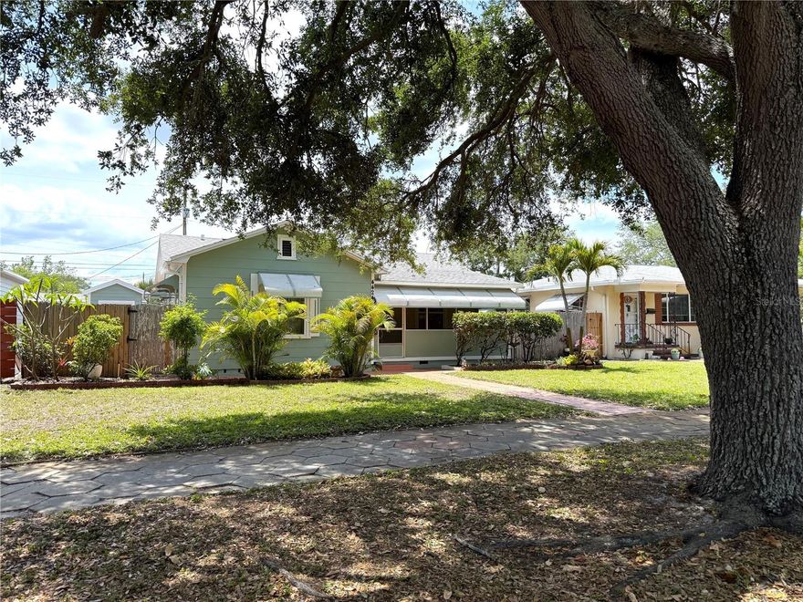 Location, Location, Location! Pride of Ownership abounds in this Old world charm updated Bungalow! Octagon pavered sidewalk, Brick pavered walkways, and Lush tropical landscaping with four zoned irrigation system on Well. This multi-use property is Zoned CRT-1, so it would make it the perfect Home/ office scenario and only minutes from Downtown St. Petersburg and The beautiful Gulf Beaches. Trendy Barn door opens to spacious master bedroom. Brand New roof, Newer HVAC, Updated windows, PVC plumbing, Updated electrical panel, Stylish updated bathrooms, Arched doorways, Laminate luxury flooring with custom base boards, and newer entry and side doors! Third bedroom could be used as an in-law suite. Plenty of storage space with multiple sheds and covered parking. Fully fenced yard with Alley access for a Boat or RV parking. Not in a flood zone! Centrally located with easy access to I-275, Shopping, airports, Restaurants', St. Pete pier, Dali museum, and the Vibrant night life of Downtown St. Petersburg.