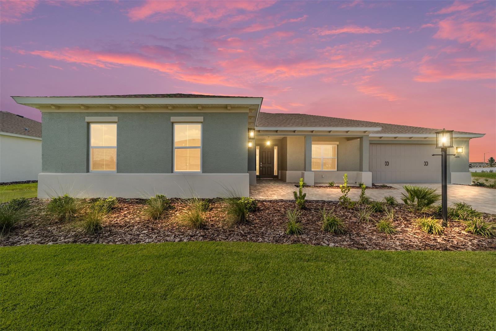 Welcome to the Dunbar model, a brand-new construction home in the highly sought-after Balfour neighborhood at On Top of the World. Offering 3 bedrooms, 3 bathrooms, and a 3-car split garage, this home is designed for both elegance and everyday comfort. Curb appeal abounds with a paver driveway and walkway framed by tasteful landscaping. Step inside to find tile flooring, tray ceilings, crown molding, and window blinds throughout, creating a bright and polished feel. The heart of the home is the chef’s kitchen, featuring staggered cabinets with crown molding, under-cabinet lighting, quartz countertops, a beautiful backsplash, oversized island, stainless steel refrigerator, built-in oven and microwave, 5-burner cooktop with range hood, and a walk-in pantry. The kitchen opens seamlessly into the living area, which boasts a 4-panel sliding glass door leading to the screened lanai, perfect for entertaining or relaxing. The primary suite is a private retreat with a tray ceiling, 3-panel window overlooking the backyard, and an en suite bath featuring a double vanity, zero-entry tiled shower with built-in bench, and a huge walk-in closet. One of the guest bedrooms also enjoys its own en suite bathroom, complete with a single vanity sink and tiled shower with sliding glass door, while the third bedroom and additional full bath provide space and comfort for family or visitors. Enjoy Florida living year-round from the covered and screened lanai or take advantage of the incredible amenities of On Top of the World, including golf, fitness centers, swimming pools, pickleball and tennis courts, scenic walking trails, and a vibrant calendar of social activities. This brand-new Dunbar model blends modern design with timeless comfort — don’t miss your chance to call it home! Call and schedule your private showing today!