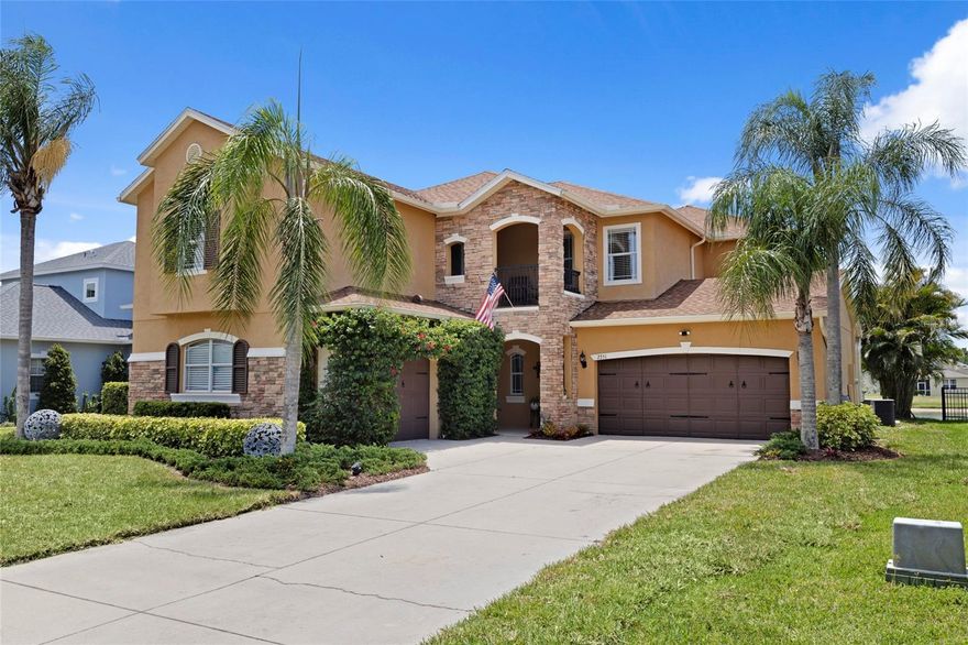 Welcome to this stunning two-story Mediterranean-inspired residence offering breathtaking lake views and an exceptional blend of elegance, comfort, and everyday functionality. From the moment you arrive, the stone-accented façade, lush tropical landscaping, and grand curb appeal create an unforgettable first impression. Step inside to a dramatic two-story foyer where soaring vaulted ceilings, warm luxury vinyl plank flooring, and a sweeping staircase set the tone for the thoughtfully designed interior. A formal living room just off the entry offers an inviting space for relaxing or entertaining, while graceful arched entryways throughout the home add timeless architectural character.
At the heart of the home is a spacious, light-filled kitchen featuring crisp white cabinetry, stainless steel appliances, stone countertops, a stylish backsplash, and a charming freestanding island. The kitchen flows seamlessly into a sunny breakfast nook with tranquil lake views and sliding glass doors leading to the screened lanai, creating the perfect indoor-outdoor lifestyle.
Designed for both entertaining and everyday living, the elegant formal dining room showcases a tray ceiling, striking chandelier, and classic wood shutters, while the dramatic two-story family room is filled with natural light from expansive clerestory windows above.
The spacious primary suite serves as a private retreat, complete with a tray ceiling, private balcony overlooking the sparkling lake, and a luxurious en-suite bath featuring dual vanities, a soaking tub, and a separate glass-enclosed shower.
Upstairs, three additional well-appointed bedrooms provide comfort and flexibility, along with a versatile loft/flex space ideal for a home office, media room, playroom, or additional lounge area.
Step outside to the screened lanai where peaceful lake views and a beautifully maintained backyard create the perfect backdrop for morning coffee, evening sunsets, or weekend gatherings.
Residents enjoy access to resort-style community amenities including a sparkling pool, playground, tennis courts, and scenic walking and hiking trails offering the very best of the Florida lifestyle.