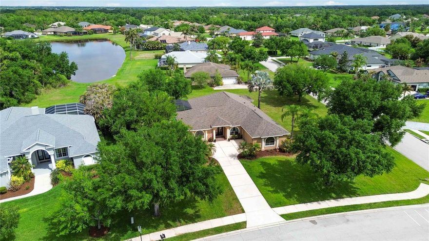 Welcome to Twin Rivers, where oversized homesites, custom homes, and a true sense of space make this community stand out from the rest. Situated on a 3/4-acre corner lot with pond views and mature landscaping, this beautifully maintained 3-bedroom, 3-bath home with a versatile bonus room offers style, comfort, and value in one of Parrish’s most sought-after neighborhoods.

The outdoor living is a true showstopper, featuring a heated pool with sun shelf and water features, beautiful pavers, and multiple covered seating areas designed for year-round enjoyment. Inside, you’ll find a spacious layout with modern bedrooms, a formal dining room, an entertainer’s kitchen open to the family room, and a flexible bonus room perfect for an office, gym, playroom, or guest space.

This custom-built home is full of thoughtful design, including a luxurious primary suite with a drive-through shower, Hollywood soaking tub, and a massive custom closet. The oversized garage offers room for more than two cars plus extra storage. Major updates include a new roof in 2025 and HVAC in 2020.

Twin Rivers is loved for its large lots, Manatee River access, and lively community feel with year-round events and multiple food trucks each week. This is a rare opportunity to own a home with character, space, and resort-style outdoor living at an unbeatable price.