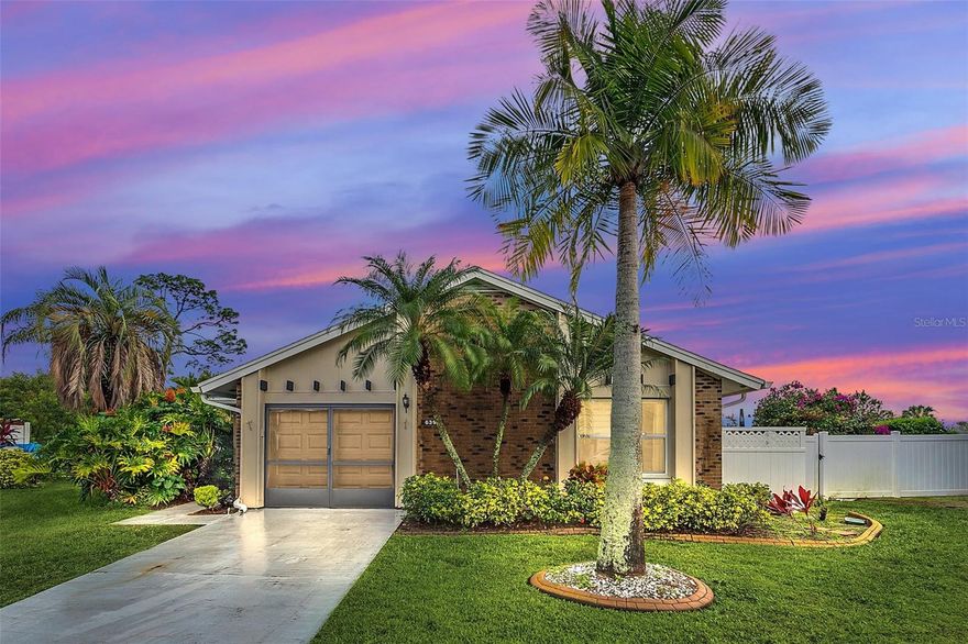 Live in your own resort! This highly upgraded, 2 bedroom, 2 bath home is located on the 8th hole of Ventura Country Club’s golf course. Features include porcelain tile floors, new windows, new roof, custom blinds, and custom draining system. The dream kitchen features exotic granite slab counter tops and backslashes, a nearly new Samaung range with air fryer mode, new lighting, and custom electrical and USB outlets. Both bathrooms have been remodeled. Guest bathroom has custom antique style vanity with glass vessel sink, and a frameless shower. Because of the unique triangular shape of the lot, this is one of the few VCC golf course front properties that also has a large, fenced side yard - perfect for pets. (HOA rules don't allow fences on property adjacent to golf course.) Enjoy fabulous Country Club living amenities without the expense. Ventura Country Club is owned by the HOA so residents can use its tennis courts, Olympic sized swimming pool, fitness center, playground, hiking trails, banquet facilities (up to 4 hours), & restaurant facilities at no cost. Residents have access to the 18 hole golf course, recently renovated, at reduced rates. The Community offers many activities including ACBL Sanctioned Duplicate Bridge games and lessons, Pickleball, Cooking Classes, Book Club, Holiday Celebrations, and much more. VCC is a beautifully landscaped and well maintained community of over 1700 luxury homes and condominiums in Southeast Orlando. It is located close to shopping, restaurants, Downtown Orlando, Orlando International Airport, Highways 408 and 417 and SR-436. Note: some photos have been virtually staged.