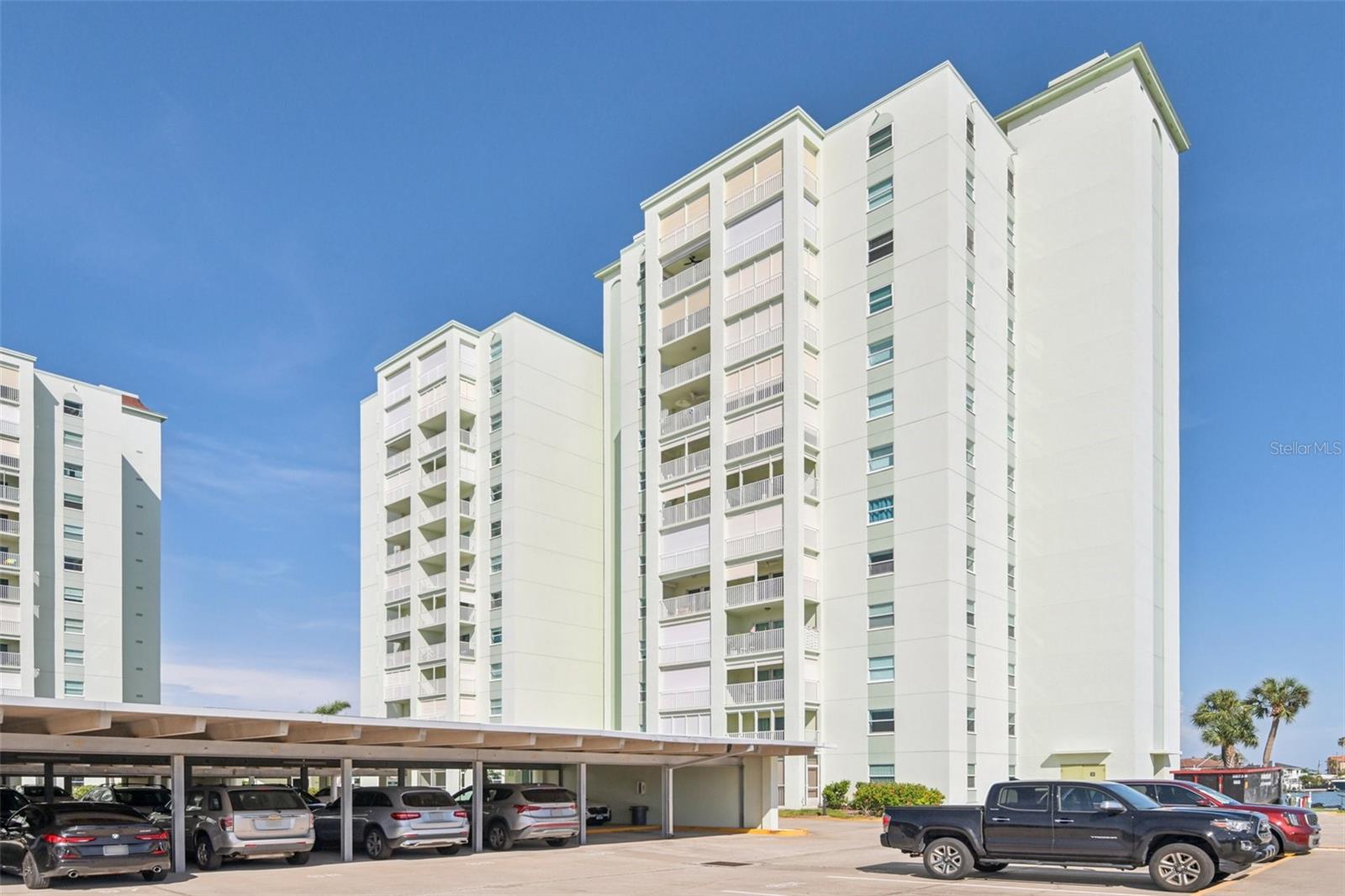 One or more photo(s) has been virtually staged. Live the Beach Life at Three Palms Point! Located just TWO blocks from the sandy shores of St. Pete Beach, this beautifully updated 2-bedroom, 2-bath corner unit is filled with natural light and showcases true pride of ownership.Enjoy convenient same-floor laundry, deeded parking spot #182 , and a private storage unit. Additionally , Recent upgrades include an inverted kitchen ceiling, paint and trim, modern lighting, stainless steel appliances with a water filtration system 2022 granite countertops 2023, a sleek glass walk-in shower 2024 and a New water heater 2025. This well-managed, secure community offers resort-style amenities including gated entry, a heated waterfront pool, clubhouse with billiards, fitness center, sauna, shuffleboard, fishing pier, kayak/bike storage, and rentable boat slips. Whether you’re walking to nearby beaches, restaurants and shops or exploring downtown St. Pete’s museums, sports, and dining—this location offers it all. And with Tampa International Airport just a short drive away, you’ll love how easy it is to travel. This beautifully updated CORNER UNIT has been well maintained unit has a list of upgrades the current owner completed, you can move in tomorrow and enjoy being a bike ride away from the beach! Live where others vacation—schedule your showing today!