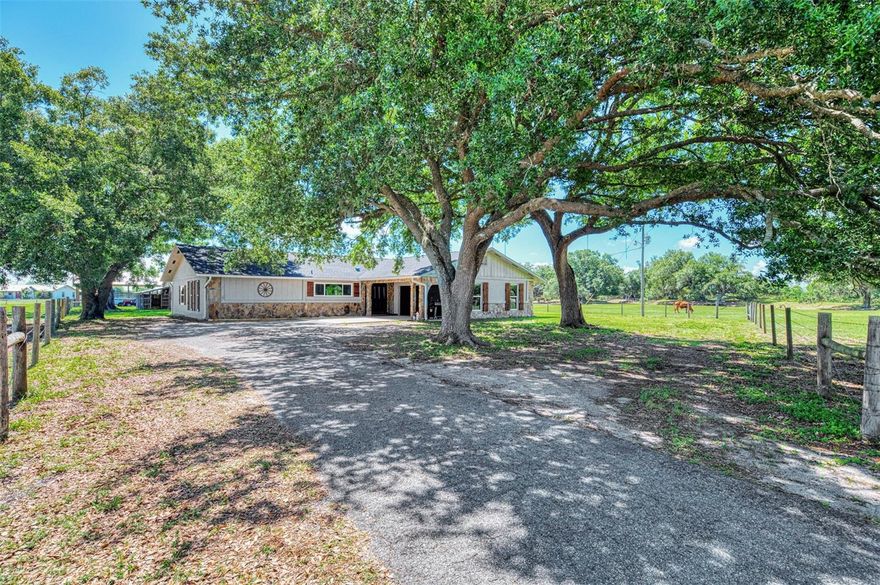 DON'T MISS THIS ONE!!  BRING YOUR FARM ANIMALS, TOYS, AND FURNITURE!! This stunning modern farmhouse on over 10 acres is everything you’ve been waiting for!! Located in one of the most desirable areas of DeSoto County, this beautifully updated 4-bedroom, 2-bath home perfectly blends rustic farmhouse charm with stylish modern finishes. Inside, you’ll find shiplap accents, exposed beams, and sliding barn doors paired with granite countertops, stainless steel appliances, subway tile, and thoughtfully designed living spaces throughout.  This property is loaded with upgrades and features for peace of mind living including a NEW ROOF in 2023, newer HURRICANE IMPACT WINDOWS (2020), newer septic system (2017), an updated two-zone A/C system with new ductwork, a huge bonus room, an oversized two-car garage, workshop space, a BRAND NEW POLE BARN, and so much more!! The paved driveway and automatic gated entrance add convenience and privacy from the moment you arrive. If you love the outdoors or want to try your hand at farming, you will love the impressive outbuildings, including a large barn with covered storage for ATVs, boats, or equipment, plus enclosed workshop/man cave space, hay storage, and even a chicken coop!!  The property is fully equipped for country living with both a traditional deep well for the home and an artesian well for livestock watering. Add a garden and create your own private, self-sustaining retreat!! Backing up to the beautiful RV Griffin Reserve and situated at the end of the street with minimal traffic, this peaceful property offers privacy, scenic views, and a small creek running through the land — perfect for HORSES or CATTLE!! Rarely does a property combine modern updates, functional acreage, and farmhouse character quite like this one.  And it's ideally located (NOT IN A FLOOD ZONE!!) close enough to shops, restaurants, golfing, and HISTORIC DOWNTOWN ARCADIA, yet far enough to get away from it all!!  Call today to schedule your private tour!!