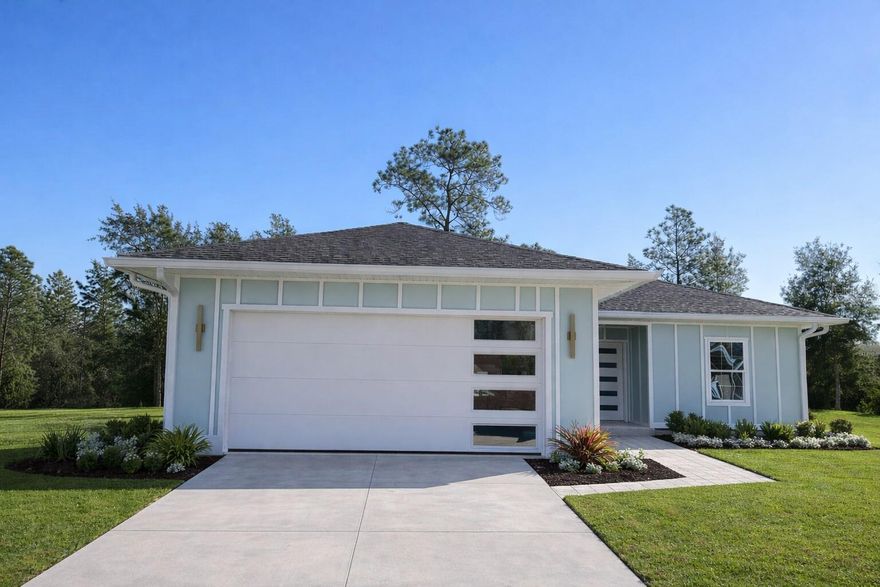 One or more photo(s) has been virtually staged. Under Construction. This 2026-built home in Williston Highlands stands out among other new constructions in the area. Thoughtfully designed and curated to elevate style, this custom-build blends comfort, luxury, and affordability. The three-bedroom, two-bathroom home boasts a modern, sleek design, featuring board and batten exterior, upgraded garage and front doors. A spacious great room with high ceilings flows into the kitchen, which includes beautiful cabinetry, stainless steel appliances, quartz counters, and a dining area with French doors opening to a large covered back porch. The primary suite features an en-suite bath with a walk-in shower, double vanities, and dual walk-in closets. On the other wing are two guest bedrooms with ample space and a shared bath. With tile and luxury vinyl plank flooring throughout (no carpet!), thoughtful and premium fixtures, coach lights, fans, and blinds included, plus wide roof overhangs and gutters, every detail has been considered. This is not your typical builder-grade spec home. Come check it out! Completion in 45 days. Professional photos coming soon. Levy County's lower taxes and large yard spaces make this home a true gem—all for under $300,000. The main photo is a digital rendering with hardscape enhancements and may not fully represent the final delivery.