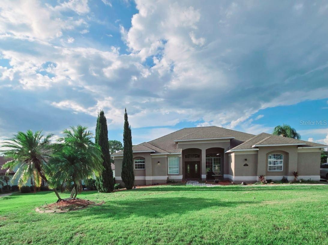 Welcome to this stunning one-of-a-kind residence in the serene and highly sought-after Lake Ridge Club community. With 6 bedrooms, 3.5 bathrooms, a spacious loft, and a fully finished basement, this home is designed for both comfort and entertaining.
The split floor plan ensures privacy, with the expansive main bedroom serving as your personal retreat. It features coffered ceilings, double doors opening to a loft and balcony, and a spa-like en-suite bathroom complete with dual walk-in closets, double vanities, a large shower, and a separate toilet room.
Adding a touch of intrigue, a custom-built library door conceals a hidden stairway to the finished basement—an entertainer’s paradise spanning over 2,100 sq ft. This level includes a second primary suite with a Jack-and-Jill bathroom, two additional bedrooms, a movie/media room, and a custom bar.
The heart of the home is the chef’s kitchen, boasting custom cabinetry, granite countertops, stainless steel appliances, a prep sink, and soft-close drawers. Additional highlights include:
• Remodeled guest and half-bath with farmhouse-inspired details
• High-end waterproof laminate flooring throughout the main level
• Brand new windows framing breathtaking lake views and sunsets
• Redesigned laundry room/mud room with designer tile, butcher block counters
• Screened-in porch for al-fresco dining and outdoor relaxation
• Spacious backyard perfect for gatherings
• Ample basement storage and a 2-car garage with ceiling-to-floor cabinetry
This exceptional property blends elegance, functionality, and hidden charm—making it the perfect place to call home.