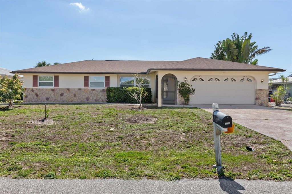 Photo of 109 Peckham Street SE, Port Charlotte, FL 33952 (MLS # C7523183)