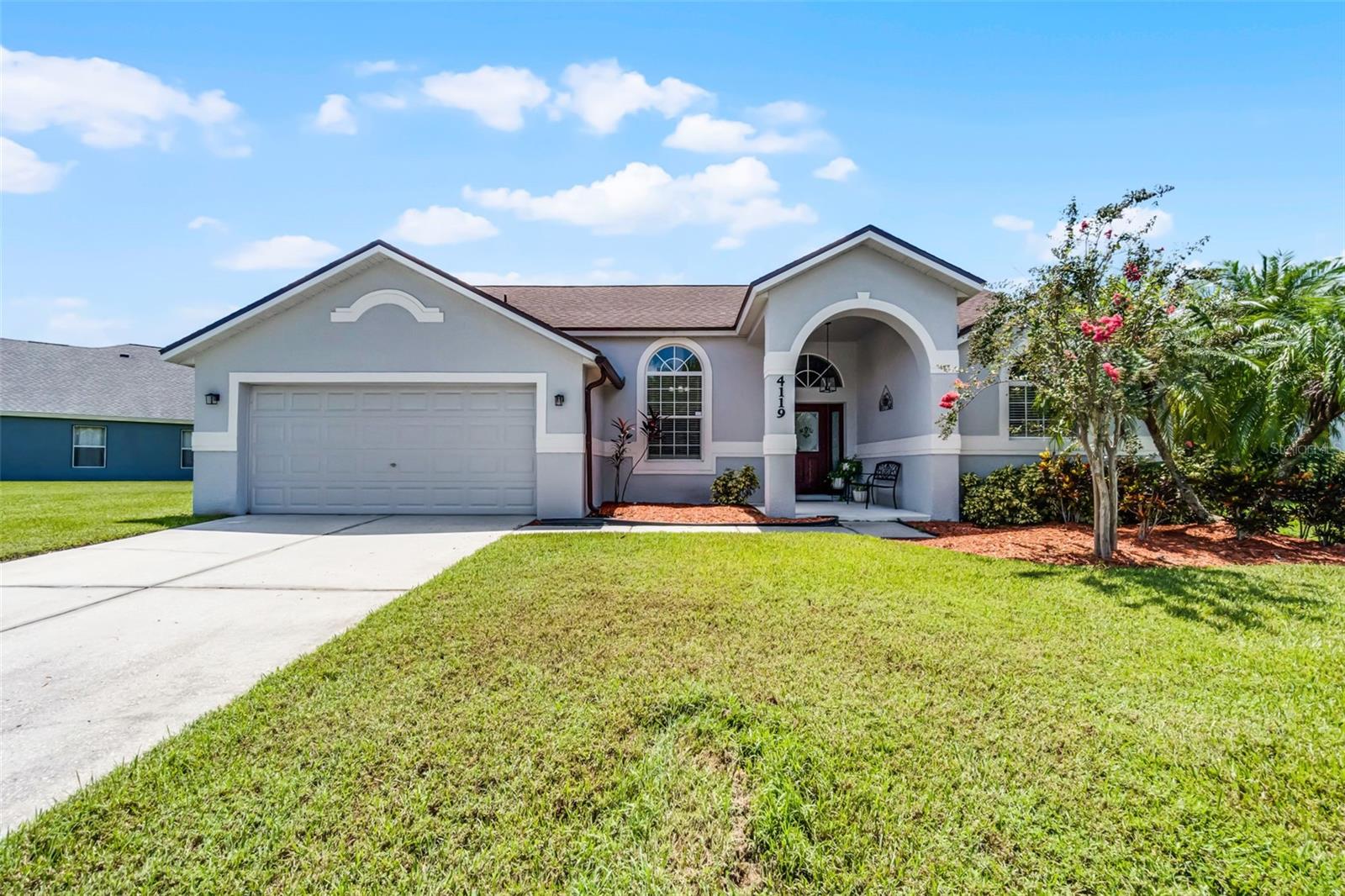 Fully paid off solar. New roof in 2023. HVAC- 2021. New tankless water heater- 2024. Newly installed insulation and gutters. Welcome to this turn-key 4 bedroom, 3 bathroom, 2-car garage home. Step inside, into the foyer with vaulted ceiling and into your dining room which flows into your living room. As you walk past the dining room, you will be greeted by the kitchen which features stainless steel appliances and a beautiful cherry wood cabinets. The family room and breakfast nook are off of the kitchen, making it the perfect home for entertaining. A split floorpan is ideal and offers a private retreat for you and your family or guests. Step into your primary suite with sliding glass doors that lead out to your covered lanai, vaulted ceilings, and an ensuite bathroom with dual sinks, an elegant freestanding tub, and a beautifully renovated, walk-in shower. On the opposite side of the home, you will find the 3 additional bedrooms, and two freshly renovated bathrooms. Step outside onto your covered and screen-enclosed outdoor lanai and enjoy the beautiful views of the pond. The spacious backyard is a great addition and offers plenty of space for play and entertainment. The paid off solar allows for very low electric bills and is energy efficient! Sellers are also providing a home warranty plan for 1 year! Within the Indian Lakes community, you will find a large outdoor pool with public restrooms, a tennis court, sidewalks throughout, and a shaded playground area. In close proximity to Florida’s Turnpike for easy commutes and only 35 minute drive to Disney, 30 minute drive to Universal, this home is in an ideal location. Make this move-in ready home your forever home! Schedule a showing today!