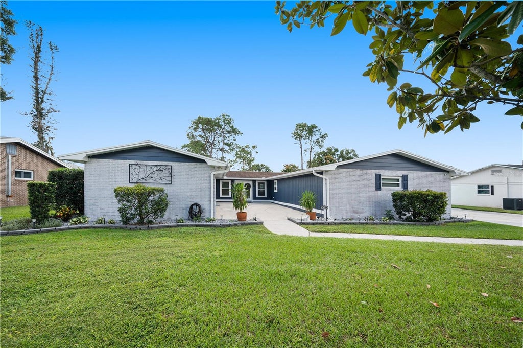 Photo of 1321 Lake Miriam Drive, Lakeland, FL 33813 (MLS # TB8559092)