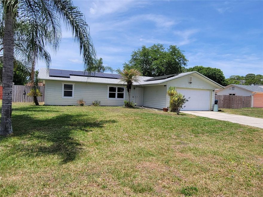 One or more photo(s) has been virtually staged. Palm Bay pool home offering a 3-bedroom, 2-bath split-plan layout with a fenced backyard and attached two-car garage. The home features a spacious main living area with natural light, tile flooring in several areas, and a primary bedroom with en-suite bathroom. The split-bedroom design provides added privacy, and the backyard offers poolside potential for outdoor living and entertaining. Conveniently located near shopping, dining, schools, commuter routes, and area amenities. Property is sold as-is. Buyer and buyer’s agent to verify all information, property condition, room dimensions, systems, permits, and suitability.