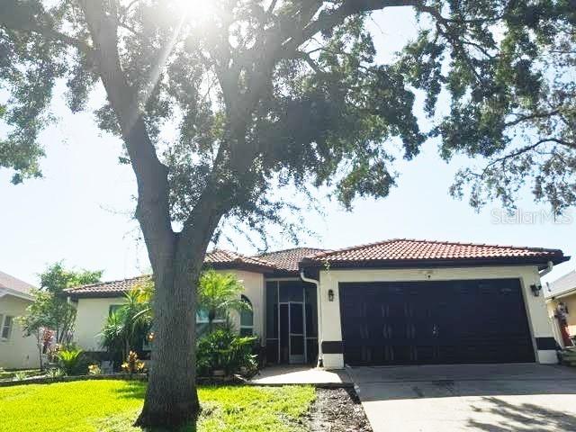 Welcome to your sun-drenched oasis in Tarpon Springs! This stunning 3-bedroom, 2-bathroom pool home boasts an expansive open-concept design that truly makes the most of its ample natural light. From the moment you enter, you'll appreciate the seamless flow between the spacious living areas, all overlooking your private pool. The kitchen and bathrooms have been completely updated with modern aesthetics and high-end materials. Enjoy the benefits of a solid roof and newly installed solar panels, keeping your home comfortable and efficient. Located in a highly sought-after x500 non-flood zone, this home offers easy access to all the best Tarpon Springs amenities from vibrant dining and shopping to beautiful beaches and the iconic Sponge Docks.