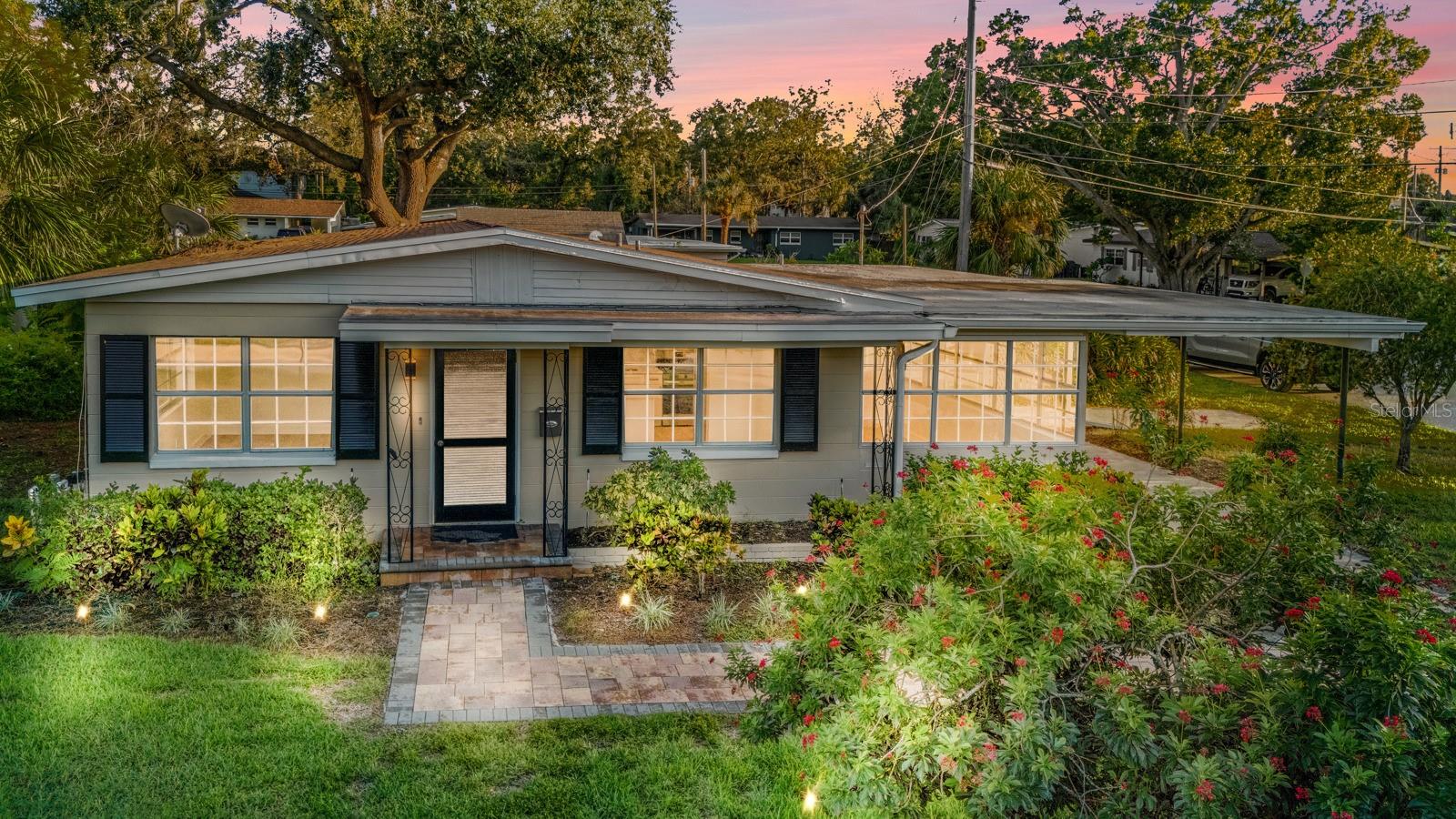 Welcome to this CHARMING remodeled 3 bedroom, 2 bath South Tampa home offering 1,382 square feet of living space on a prime corner lot. Recent updates include a brand-new AC system, luxury vinyl plank flooring, and a completely renovated kitchen with quartz countertops, updated cabinetry, and an eating area that flows seamlessly into the living room. Both bathrooms have been tastefully updated with modern finishes. Outdoor living is easy with a screened back porch and fenced backyard, while the paver driveway and carport provide added convenience and curb appeal. Ideally located near restaurants, shopping, International Plaza, and just a short drive to Tampa International Airport, this home combines comfort, style, and convenience in one desirable package.