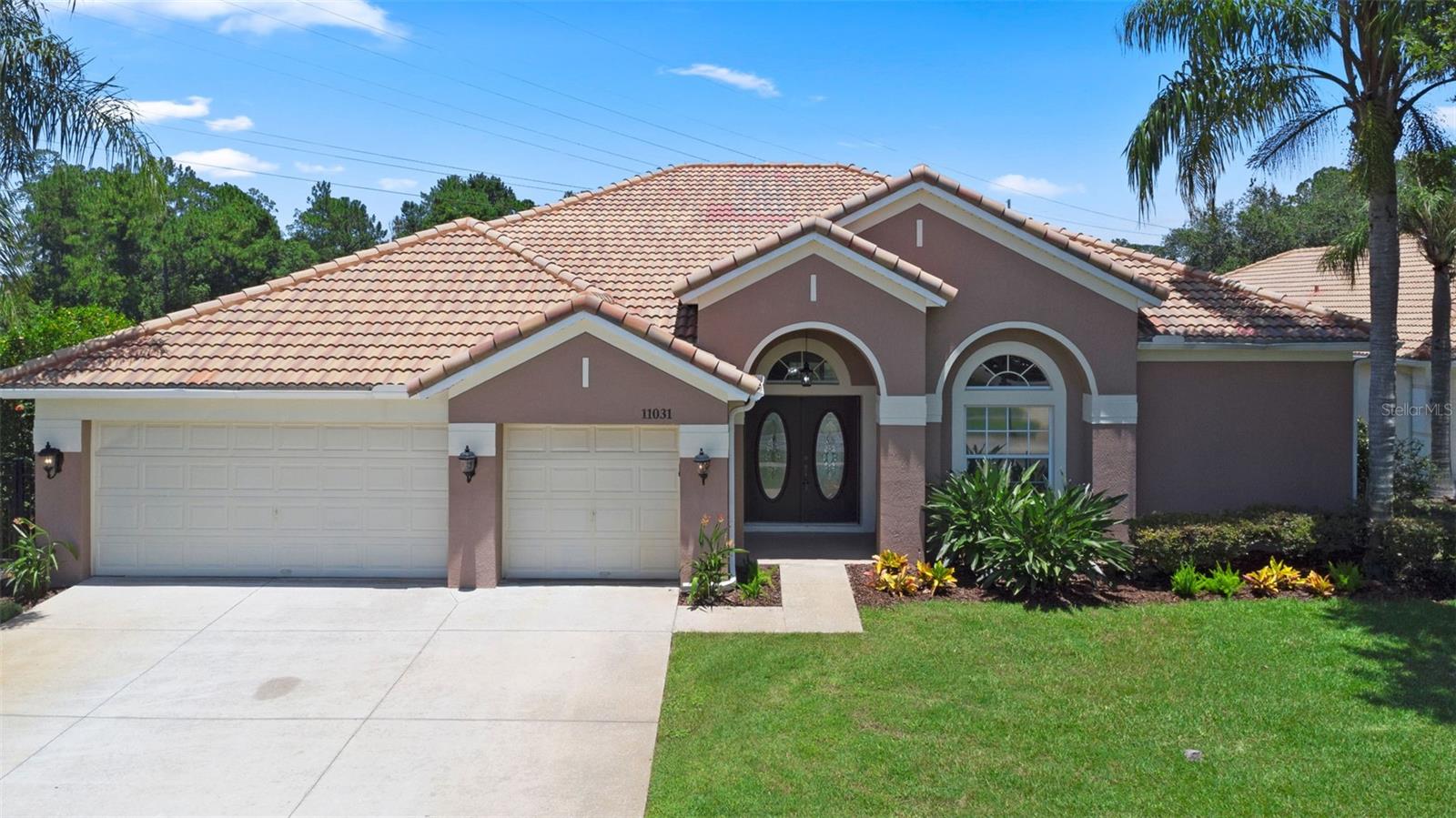 Stunning WATERFRONT EXECUTIVE POOL HOME with 5 BEDROOMS 3.5 BATHROOMS 3 CAR GARAGE + 0.45 ACRES! + Conservation Views in Fully Fenced in Backyard with 2,750+ square feet of living space in the GATED community of GLENMUIR, one of Windermere’s most desirable communities! Open entering the foyer with a travertine medallion inlay, this home boasts upgrades and a wonderful true split plan. The 5th bedroom, which could also be a perfect office or bonus room is at the front through double doors. The space moves on to present a large formal living and dining room area, highlighted with a chair rail above board and batten accents, as the travertine tile expands throughout the home, with a view of the pool, water and conservation through triple glass sliders. The custom kitchen remodel includes granite countertops and backsplash, stainless steel appliances including an induction range top oven, built in Thermador Espresso/Coffee machine, pot holder above kitchen island, custom stained glass cabinet inserts, an extended butler’s pantry towards the dining room, along with extra storage including pull out spice racks. The primary bedroom is very spacious with triple glass slider access to the covered pool patio area. The primary bathroom is complete with a dual vanity, garden tub and walk in shower, including a large walk in closet. The kitchen opens to a large great room that separates an additional section of the house that includes 3 bedrooms in one hallway. One bedroom has its own en-suite with another having en-suite access to the hallway bathroom. The covered pool patio area has access to a separated bathroom, with a very large extended pool deck with a fully screened in SALTWATER SOLAR HEATED POOL with SPA. This backyard is a very large lot, fully fenced in with black aluminum, next to open conservation space both beside and behind the water views making it very private. This home also features a TILE ROOF, wash sink in the laundry room, crown molding, large 3 car garage, and kitchen under and above cabinet lighting. Glenmuir features community amenities that include a waterfront park with playground, basketball court and covered pavilion with picnic tables and grills. Make an appointment to see this home today!