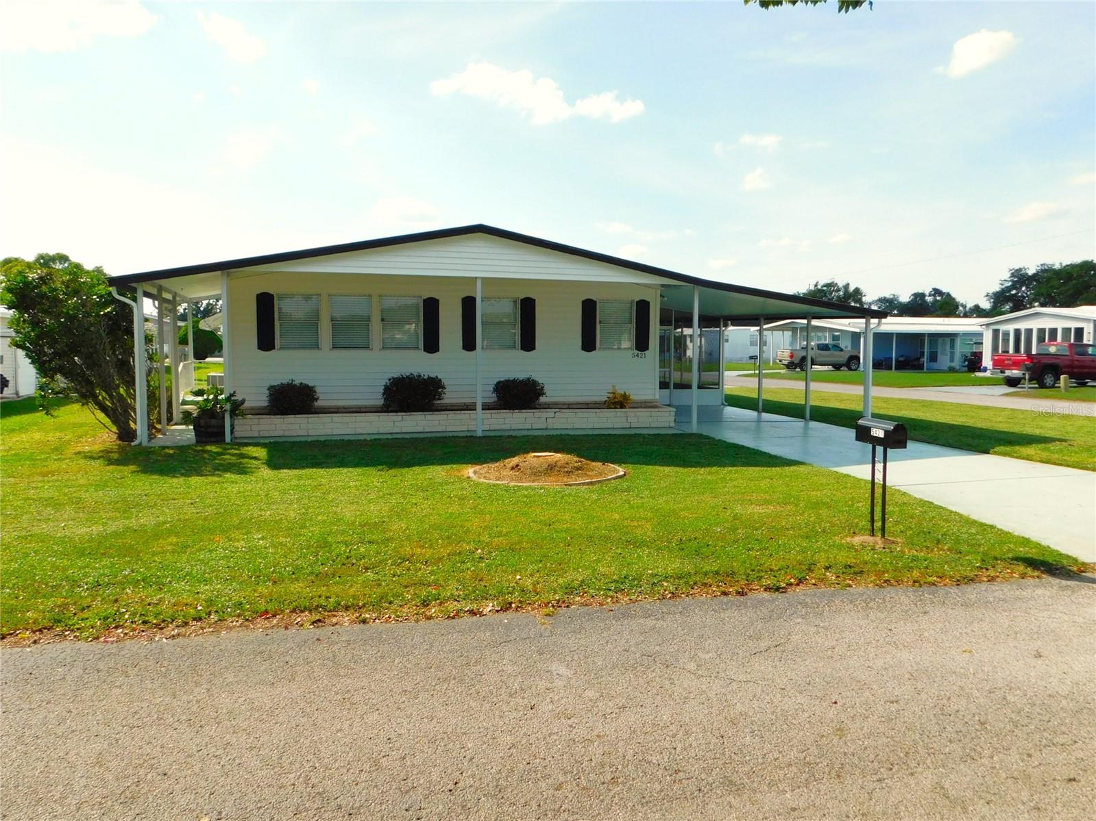 2-Bed, 2-Bath Home in Betmar Acres – You Own the Land!
Move-in ready and packed with updates! This spacious 2-bedroom, 2-bath home features a bright kitchen with all appliances—wall ovens, cooktop, refrigerator, and dishwasher—all opening to a 26' x 13' living room perfect for entertaining.
The dining area offers a built-in china cabinet and storage, while the primary suite includes a walk-in closet and private bath with walk-in shower. The second bedroom (11' x 11') has a built-in closet, and the guest bath features a tub/shower combo.
You’ll love the fresh paint, new laminate flooring, 2020 A/C, and brand-new roof (2025). Outside, enjoy a screened porch, utility room, and carport, plus a garage with roll-up door—perfect for a small car or golf cart. Two driveways on this corner lot provide extra parking and curb appeal.
And remember to check out the 27 hole golf course, 2 swimming pools and 2 hot tubs along with 3 clubhouses, a library, walking paths, game rooms , enclosed shuffleboard courts, tennis courts, pickle-ball courts, basketball court, and weekly cash Bingo.
Enjoy the Betmar Acres lifestyle—where you own the land and the possibilities!