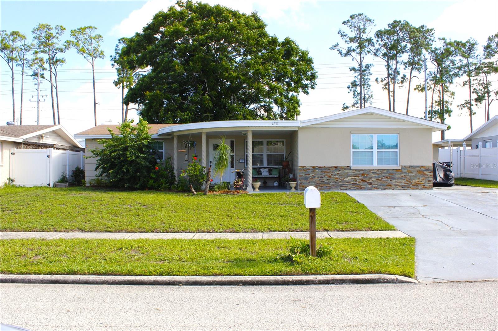 Beautifully updated 4BR/2BA residence in Holiday Garden Estates with spacious open floor design and timeless finishes. The open layout features hardwood flooring in living areas and carpet in 3 bedrooms. Kitchen includes granite counters, custom cabinetry, and stainless steel appliances. Bathrooms showcase designer tile and mosaic accents. Private-entry in-law suite adds flexibility. Energy-efficient dual-pane windows troughout the house, interior laundry, and modern stylish light fixtures throughout the house. Exterior offers storage shed. Concrete block construction, slab foundation, and roof replaced in 2020. AC 2018 and re pipe on 2022, Located near schools, shopping, and dining, just 10 minutes to the Gulf. Public utilities. No flood zone or HOA.
