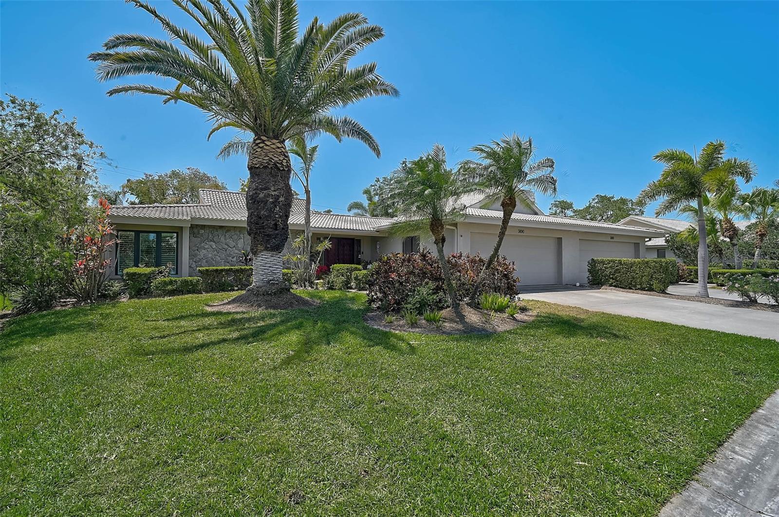 Welcome to this beautifully updated 2 Bedroom, 2 Bath villa that lives like a single-family home—without the hassle of exterior maintenance! Located in one of Sarasota’s most desirable 55+ communities, this pet-friendly villa (1 pet up to 35 lbs) offers privacy, space, and luxury in an unbeatable location. Lakeshore Village South is a small, 32-villa enclave with its own heated community pool and a socially active atmosphere for those who wish to participate. Step inside to discover a stunning, fully remodeled chef’s kitchen with rich cabinetry, soft-close drawers, pull-out shelving, and gorgeous granite countertops. The cabinetry continues into the family room, which features a wood-burning fireplace and a custom wet bar—ideal for entertaining. A formal living and dining area offers additional space to host guests or relax in comfort. Enjoy peace and serenity on the extended pavered lanai, surrounded by mature landscaping and accessed via impact-rated sliding doors. The setting feels like your own private park—quiet, green, and perfect for outdoor living. You’ll love the elegant crown molding, new flooring, and thoughtful updates throughout the home. The laundry area is neatly tucked away behind bi-fold doors for convenience and function without sacrificing aesthetics. The primary suite is generously sized with a large custom walk-in closet, a fully renovated bath, and a separate office/sitting area with built-in cabinetry. The second bedroom is bright and spacious, perfect for guests, and located adjacent to the updated guest bathroom, which reflects the same level of quality and detail. Additional features include: 2019 A/C Hot water circulation booster Keypad garage entry Ring door alert system This home offers not just a place to live, but a complete lifestyle. For just $200/year, owners can access additional amenities including a large clubhouse with a full kitchen and dining area, a heated saltwater pool, pickleball and tennis courts, and catch-and-release fishing. All this, just 20 minutes from Siesta Key Beach, consistently ranked the #1 beach in the U.S., and only minutes from top-rated medical facilities, shopping, dining, and quick access to I-75. Don’t miss the Virtual Tour and Matterport 3D Walkthrough—you’ll feel like you’re already home! Schedule your private showing today—this gem won’t last long!