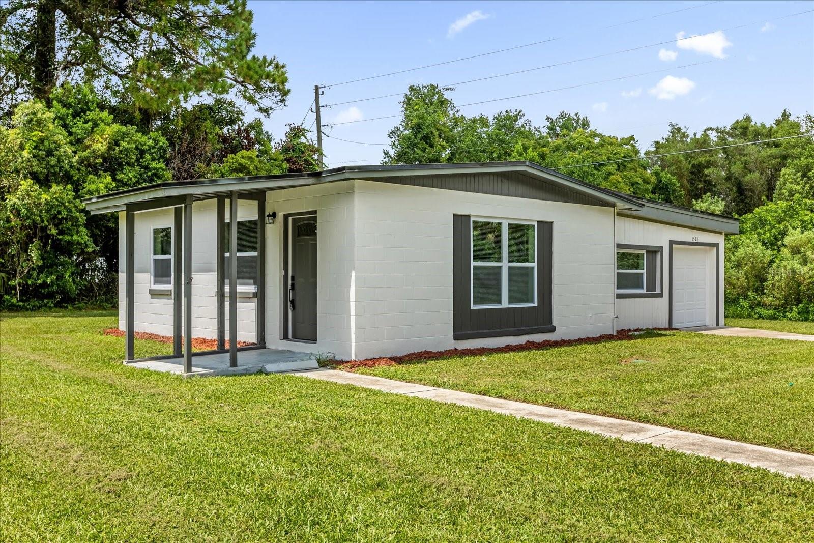 Beautiful property on an over 9000 square-foot lot, gut renovated top to bottom! Featuring a new roof, new A/C, new windows, upon entry you will find the bright and open living area, with a view of the beautifully updated kitchen. Past the living, you will find one of the two bedrooms, and the fully renovated bathroom, with new tile throughout, as well as new commode, fixtures and vanity! The kitchen features new cabinets throughout, new quartz, as well as stainless steel appliances, and a corner dining nook, as well as a bar area - perfect for a work from home area or a place to grab a quick meal! Past the kitchen is the second living area/flex space, with direct access from the garage! Through the second living/flex area, you will find the the spacious ensuite master. The master is very spacious, and features an ensuite bath that has new tile throughout, as well as a new commode, vanity, and fixtures. This home is top to bottom ready for move in, and features a 1-car garage, as well as plenty of storage in the shed in the spacious backyard - perfect for those cool fall nights! Come see this beautiful home today!