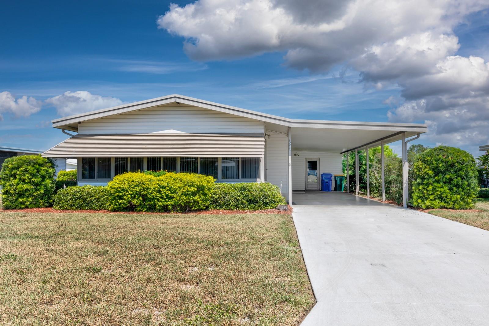 Wonderful home in Lake Frances Estates, Tavares possibly the best 55+ mobile home park in Lake County! Golf cart community affords you the freedom to explore “Sea Plane City” with festivals, parks, shopping, restaurants and breathtaking sunsets over Lake Dora. Living in Lake Frances Estates you can enjoy the tight security of the community with two pools, lots of activities and the additional convenience of taking your golf cart to the nearby grocery store. This home has been lovingly maintained and boasts 3 full bathrooms, a surprise for a 2-bedroom home, but a very nice addition for guests or cleaning up after a long day outside. Great layout for entertaining including a large enclosed front porch with separate air for relaxing evenings with friends. Both bedrooms have walk-in closets and private bathrooms with showers. Washer and dryer are housed in a huge, attached storage area and in addition there is a separate storage room attached to the rear. Rare to find fun, charm, the feeling of security and belonging in one place. Rush to make it yours!
