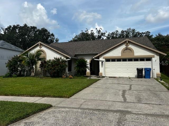 Short Sale. Experience the best of Florida living in the sought-after golf community of Pebble Creek in New Tampa. This spacious 4-bedroom, 3-bathroom pool home offers over 2,300 square feet of living space, including two separate living areas, a wood-burning fireplace, and built-in shelving. The thoughtfully designed layout provides seamless access to the screened lanai, pool (30’x12’), and spa, perfect for relaxing or entertaining.
The kitchen serves as the heart of the home, featuring granite countertops, wood cabinetry, a pantry, breakfast bar, beverage cooler, and wet bar with a pass-through to the dining area. The owner’s suite offers a spacious ensuite bath with dual vanities, garden tub, separate shower, and direct access to the lanai and pool.
A secondary bedroom with an ensuite bath is ideal for guests, teens, or as an in-law suite. The remaining two bedrooms also include walk-in closets, ceiling fans, and share a full bath. The fully fenced backyard includes fruit trees and provides excellent privacy.
Recent updates include: roof (2019), exterior paint (2019), HVAC (2010), and water heater (2015).
Pebble Creek offers tree-lined streets, multiple community entrances, and one of the lowest HOA fees in New Tampa—with no CDD. Community amenities include a pool, tennis, basketball, and volleyball courts, parks, and playgrounds.
Conveniently located near I-75, top hospitals (Advent, VA, Moffitt), dining and shopping destinations (Wiregrass Mall, Premium Outlets, Center Ice), and A/B+ rated schools, USF, and HCC. Just 25 minutes to Tampa International Airport.
Schedule your showing today—this one won’t last!