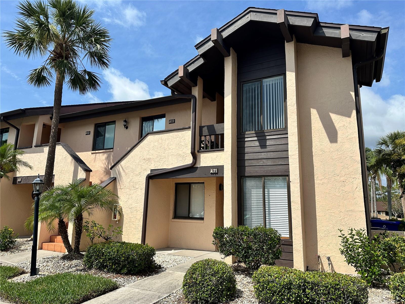 This first floor, light and bright end unit is available for a 6 MONTH rental or for an ANNUAL lease. It features all new porcelain flooring throughout the interior and stunning heated swimming pool and golf course views. The eat in kitchen has ample storage, newer appliances and a big front window allowing for a sunny place to cook and dine. The split plan bedrooms create quiet and privacy for family or guests. The primary suite boasts the big golf course views, has a large walk in closet and a lovey en suite bathroom. The utility room with a nice washer and dryer can be used for a workshop area as well. You can't beat the University Parkway location with immediate access to UTC Mall and all kinds of shopping, dining and entertainment choices. This Palm Aire Country Club community has a pool, shuffleboard and community room. Membership to the Country Club is optional and there are several membership options available. If you're looking for a fabulous location with reserved parking at your door and a lovely condo look no further!