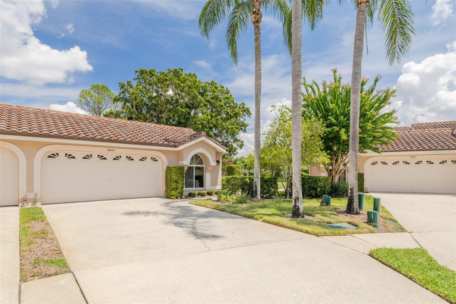 Tucked away at the end of a cul-de-sac, this villa is located inside the gated community of Salem Village, part of the beautifully maintained Ridgemoor neighborhood. Residents of this desirable community enjoy a heated pool and cabana, along with access to Ridgemoor’s park, tennis courts, basketball court, and playground. Offering nearly 1,700 sq. ft., the home features 2 bedrooms, 2 bathrooms, an office/den, and a 2-car garage. Inside, you’ll find a spacious living room with soaring ceilings, a wood-burning fireplace, and newer vinyl plank flooring that flows throughout. The kitchen is equipped with newer appliances, while the hot water tank and water softener were replaced within the last few years. A Mediterranean-style tile roof enhances the home’s charm and curb appeal. Sliding glass doors open to a screened lanai overlooking a tranquil pond, lush trees, and an oversized side yard. Reasonable HOA fees include lawn care, exterior maintenance, cable TV, internet, and trash service for a truly worry-free lifestyle. Outdoor enthusiasts will appreciate being just minutes from John Chesnut Park, with its scenic trails and boardwalks along Lake Tarpon, while the white sands of Clearwater Beach and Honeymoon Island are only a short drive away. Conveniently located near shops, restaurants, banks, and everyday essentials, this villa perfectly combines comfort, convenience, and an ideal Palm Harbor location.
