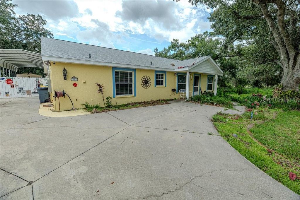 Photo of 12028 San Angela Dr, San Antonio, FL 33576 (MLS # TB8437608)