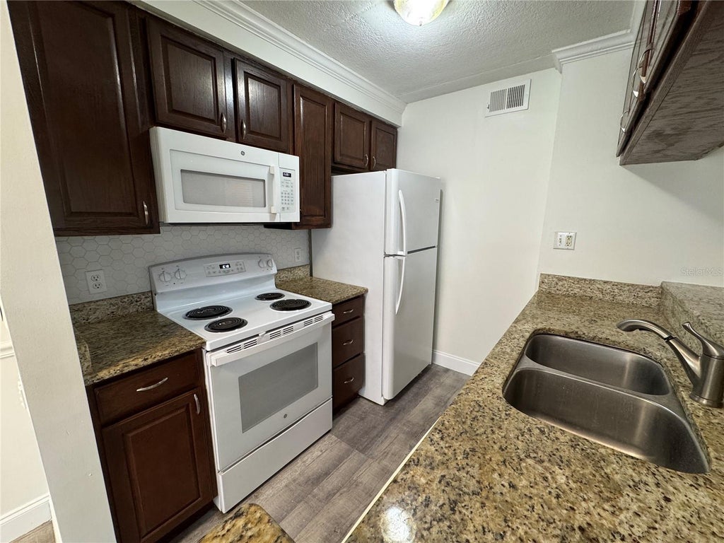 Photo of 5306 W Kennedy Boulevard #112, Tampa, FL 33609 (MLS # TB8550211)