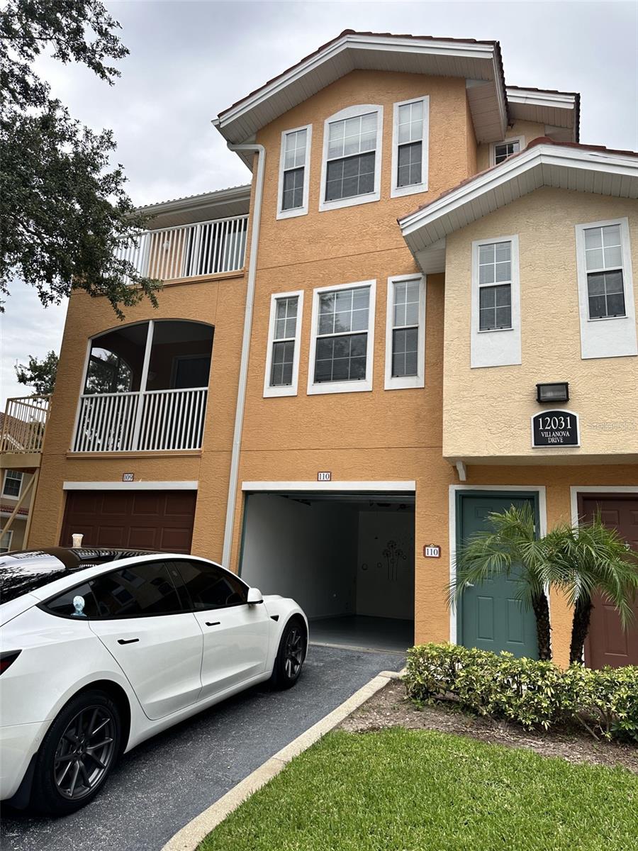Motivated seller, property unfurnished ready to view. Welcome to this stunning 3-story condominium, nestled in the heart of the charming, gated community of Villanova, within the award-winning, master-planned golf community of Hunters Creek. This end-unit residence offers an ideal blend of comfort and convenience and perfect. It includes an electric fireplace, 2 TVs, ceiling fans, and a soundbar. Double glass window, fire department direct connection. Key Features: Bedrooms & Bathrooms: Located on the 3rd floor, ensuring a private and serene living space. Master Suite Terrace: Enjoy your morning coffee or evening relaxation on the private terrace connected to the master bedroom. Main Living Space: The 2nd floor boasts an open-concept living area, seamlessly connecting the kitchen and dining room to a covered, screened balcony ideal for entertaining or unwinding. Kitchen: Well-appointed with modern appliances and ample counter space, making meal preparation a joy. Oversized Car Garage: Situated on the ground level, complete with an entry foyer for added convenience. Included Amenities: The purchase includes an electric fireplace for cozy evenings and two TVs, enhancing your entertainment options. Location: Located in Central Florida, just 15 minutes from the magical worlds of Disney and Universal Studios, providing endless entertainment possibilities. Easy Highway Access: Conveniently located for easy access to major highways, making commutes and travel a breeze. Community Highlights: Villanova at Hunters Creek: A gated community offering a tranquil environment with beautifully landscaped surroundings. Golf Community: Enjoy the benefits of living in a master-planned golf community, perfect for enthusiasts and those who appreciate a well-maintained, picturesque neighborhood. Amenities: Residents can access various community amenities, including parks, trails, and recreational facilities. This lovely condo offers a unique opportunity to live in one of Central Florida's most desirable communities. Whether you're seeking a primary residence or a vacation home, this property provides everything you need for a comfortable lifestyle.